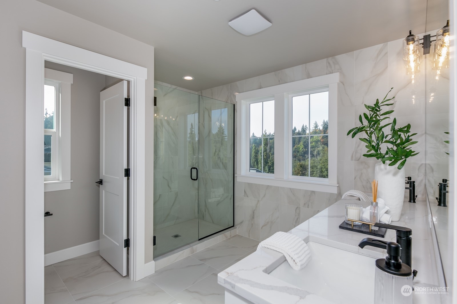 Primary bathroom offers an abundance of space and gorgeous detail.