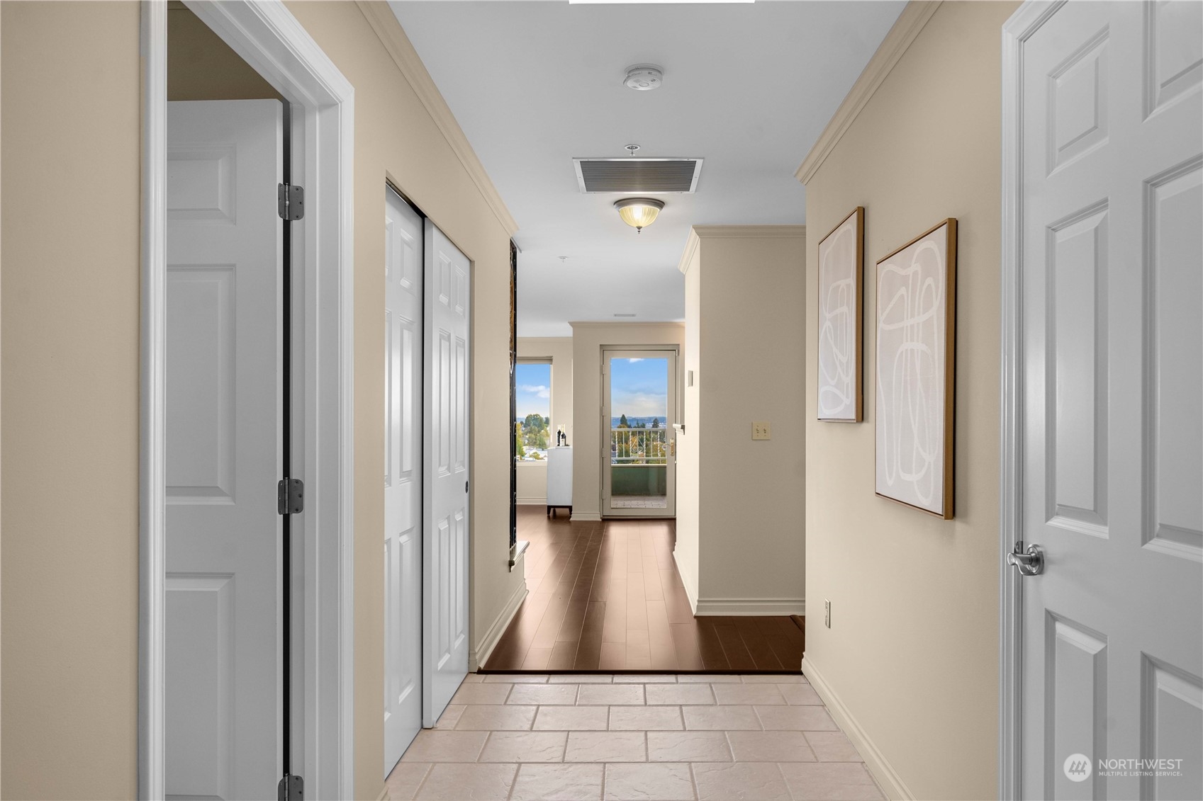 Welcome to 1201 and tiled entry with guest bedroom off to the left and guest closet space galore in the hallway