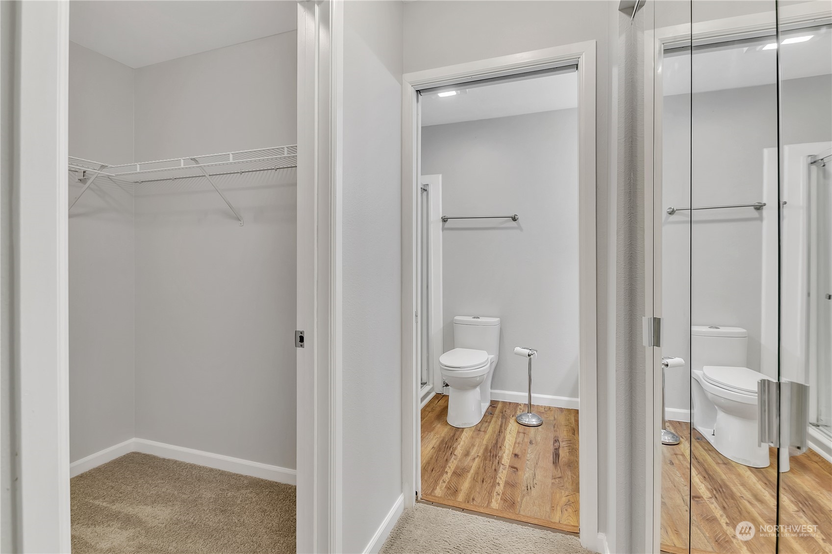 Walk in closet in primary bedroom.