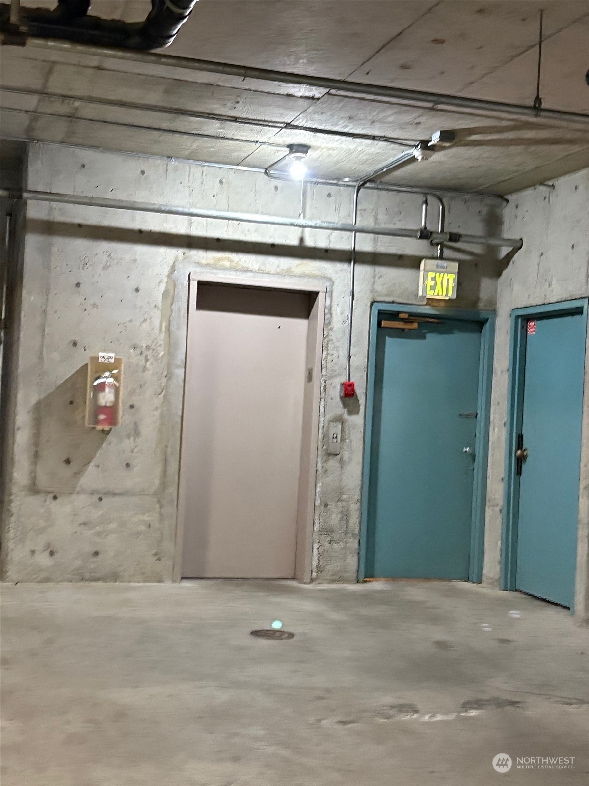 Elevator from garage. Storage room entry is the door to the right of the elevator.