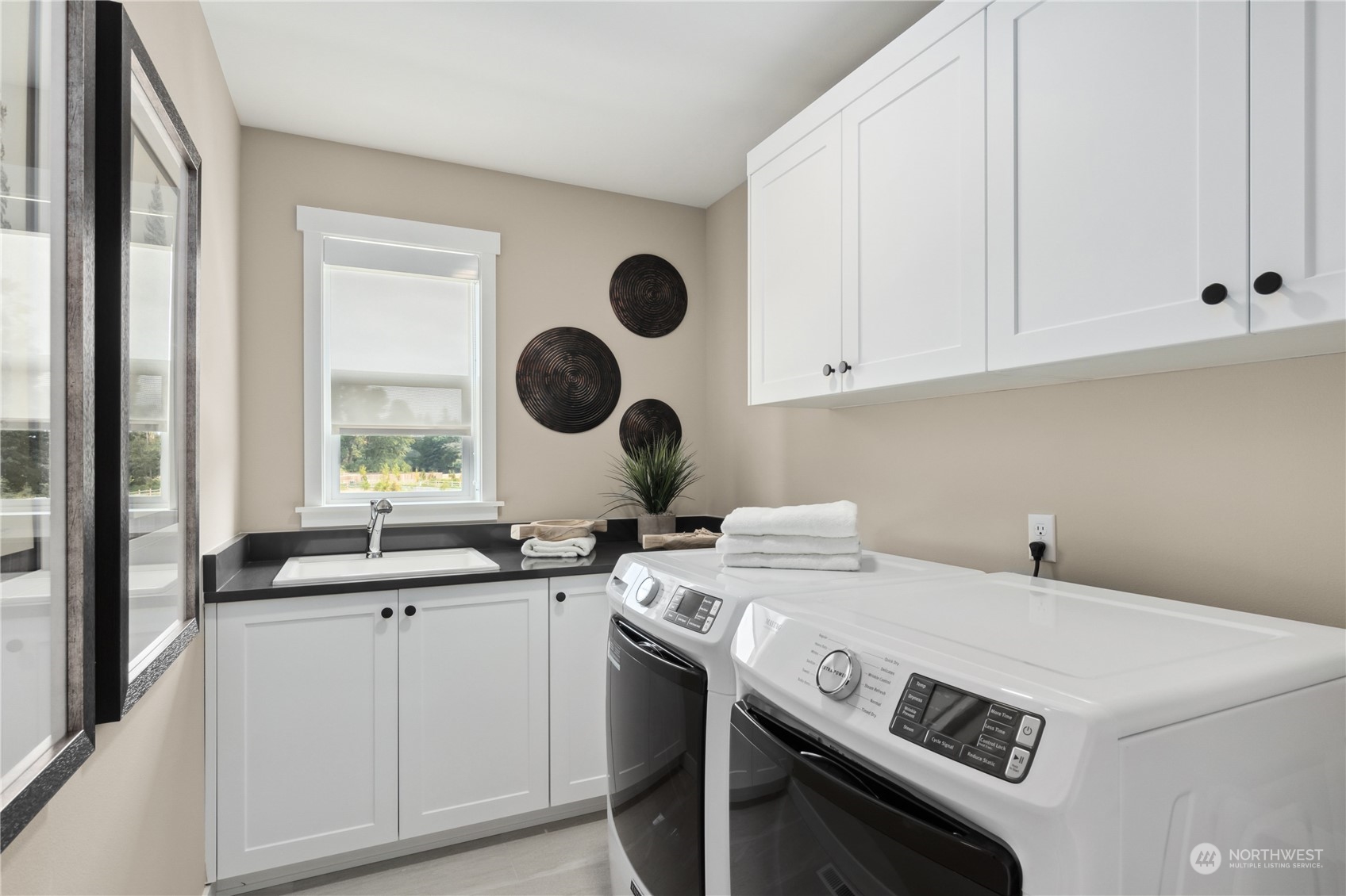 Great Laundry space with laundry sink!