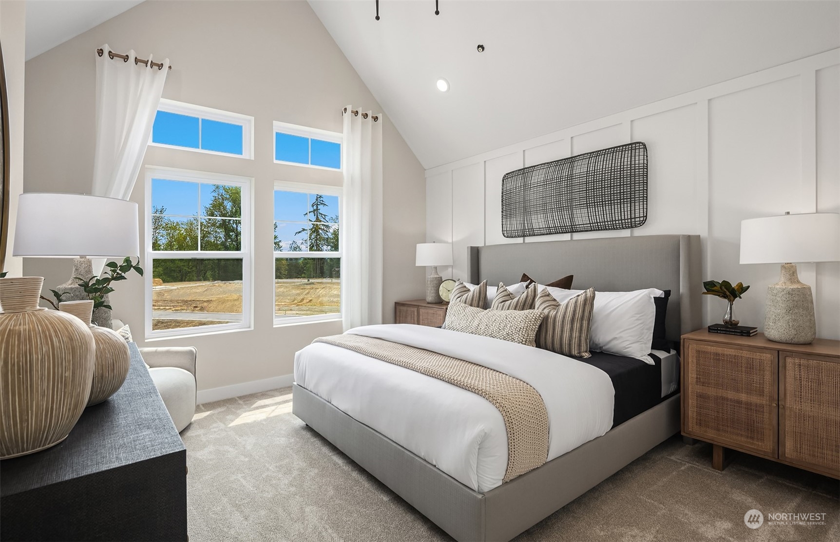 Primary bedroom w/ vaulted ceilings