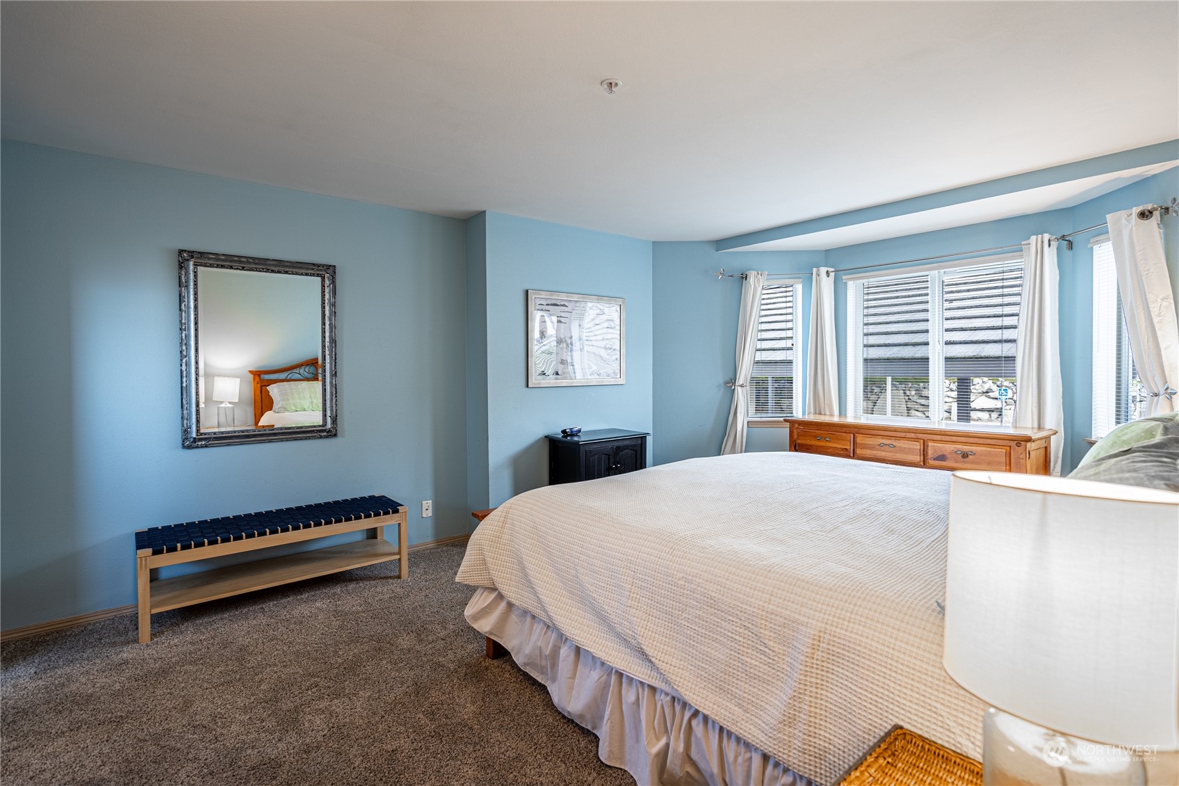 Spacious primary bedroom with king bed