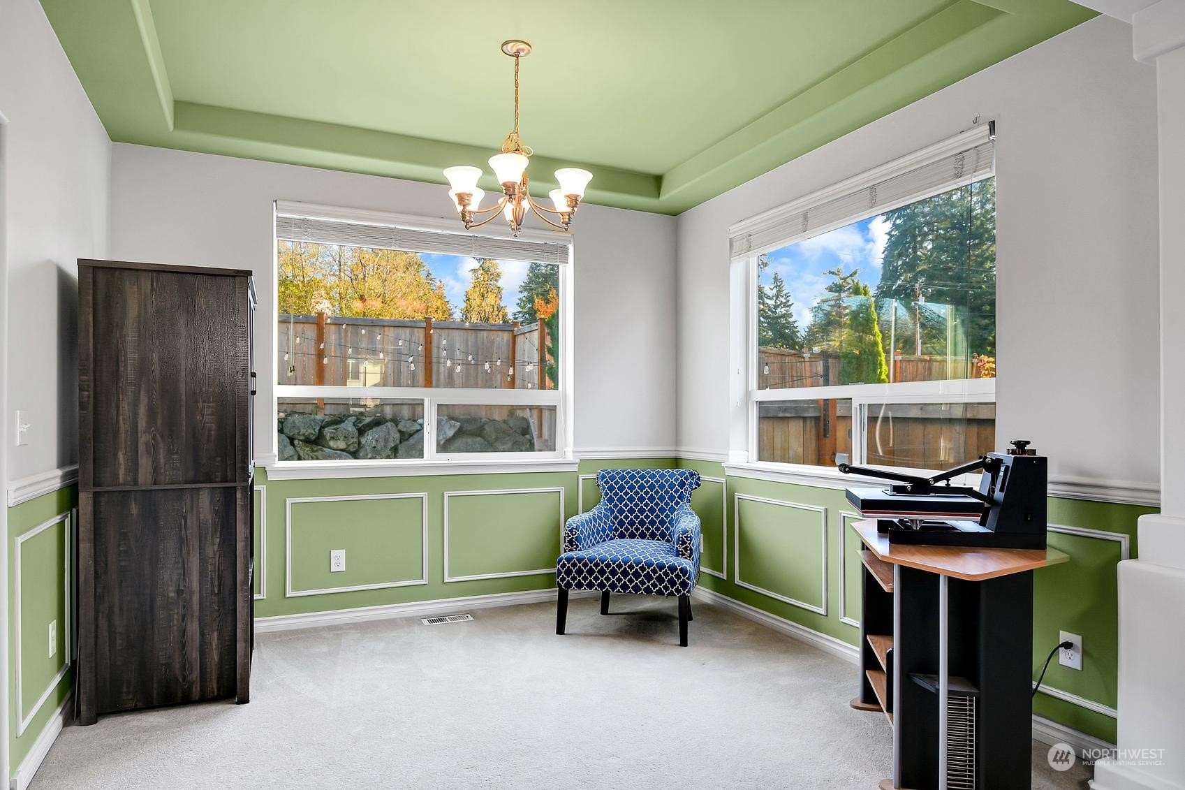 Spacious dining area with tray ceiling