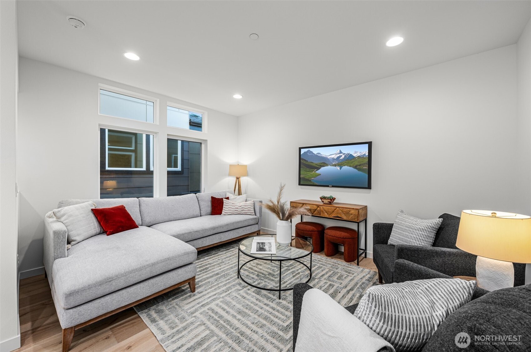 Step into the living room where entertaining feels effortless—natural light, open-concept flow, and a layout that makes sense.