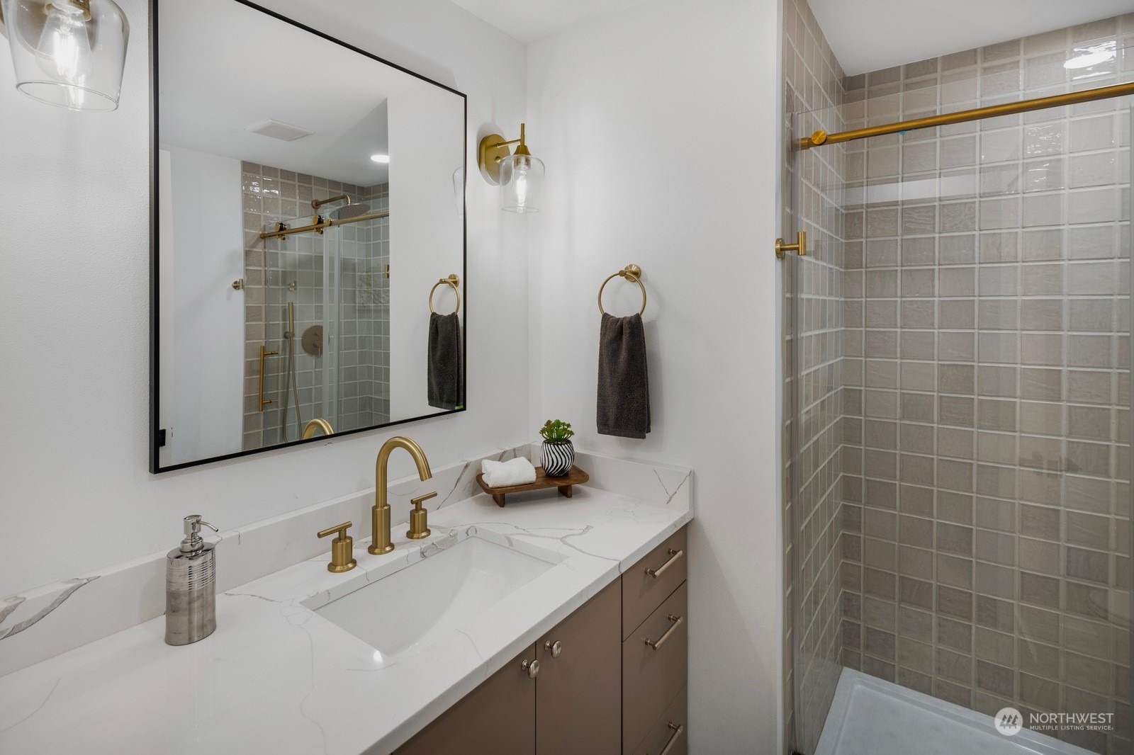 Beautiful lower level walk-in shower designed with new "chunky-grout" stone work and stunning finishes.