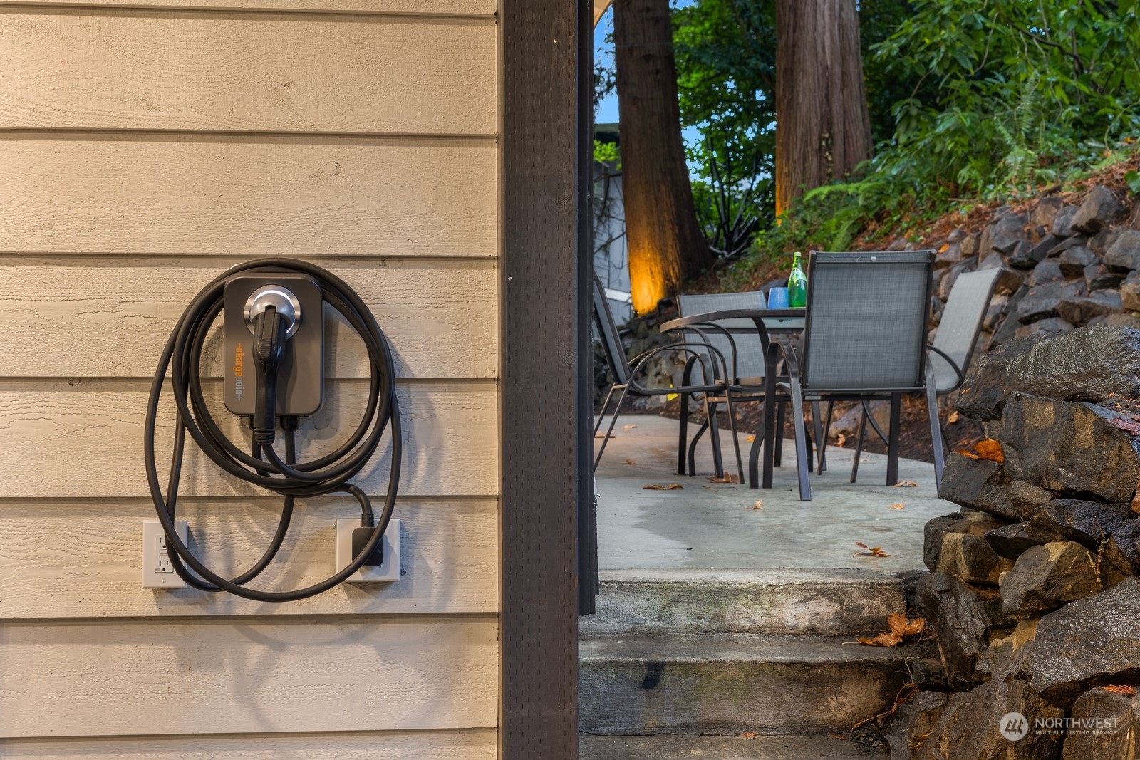 Private back patio. Concrete work and drainage all new with new exterior feature lighting on landscaping.