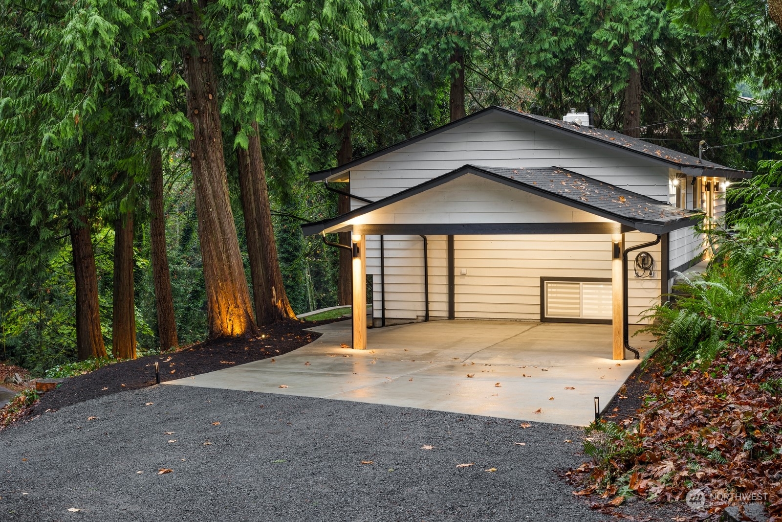 Carport large enough for potential enclosed garage conversion.