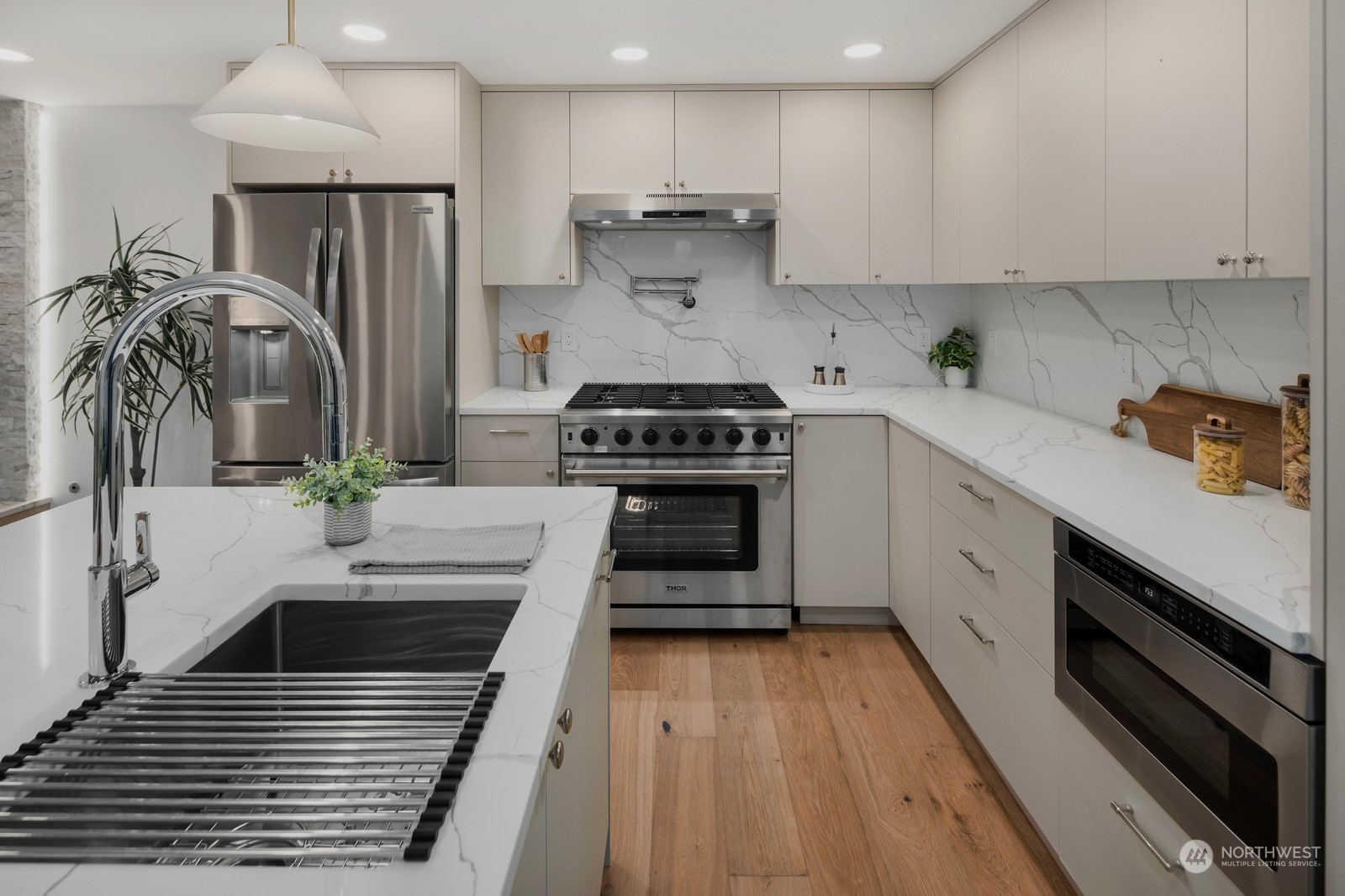 Built-in microwave, and pot filler faucet at range.