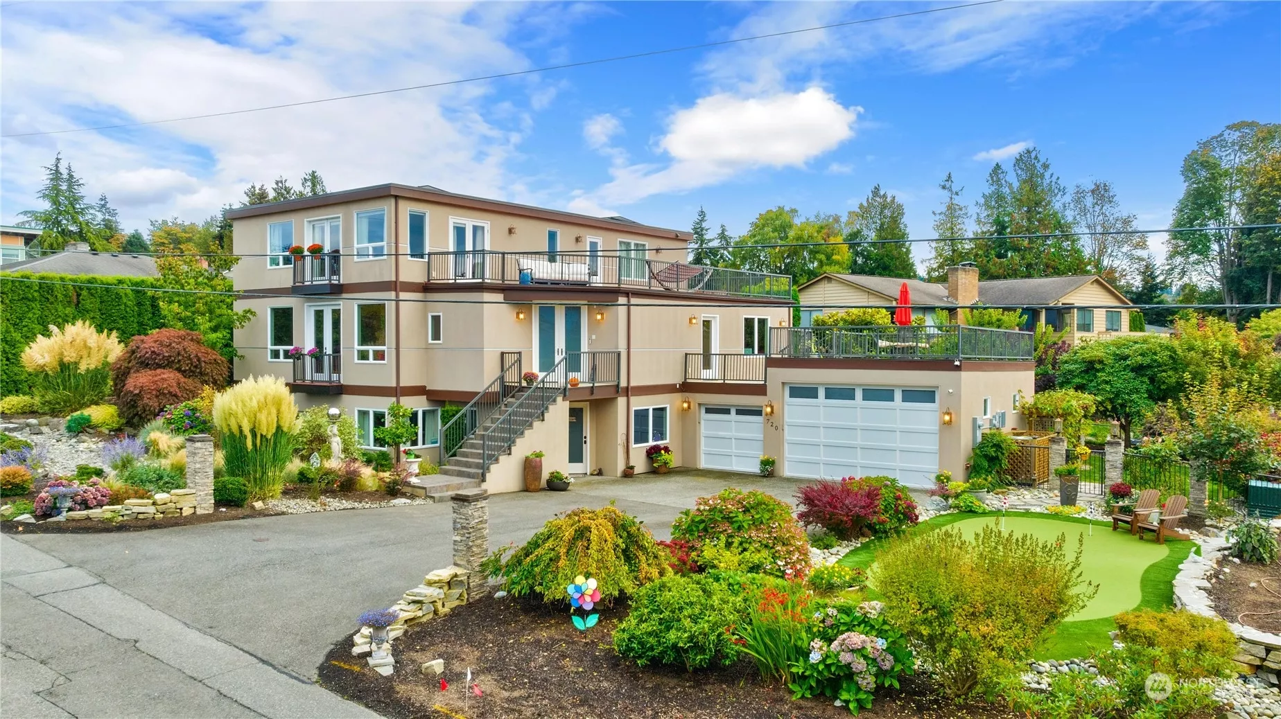 Welcome! Exquisite landscaping, putting green, bocce ball court, raised garden beds and dog area.