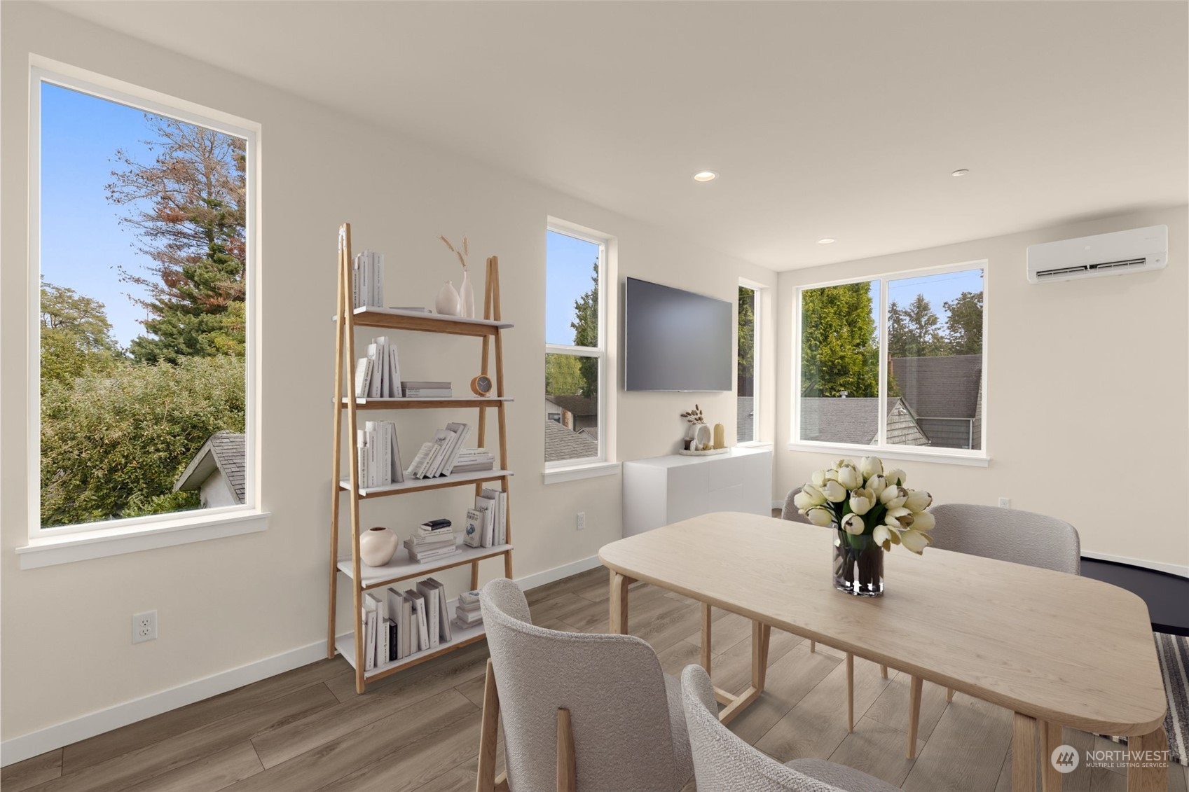 A sunlit blank canvas awaits your creative touch. With its expansive layout and large windows, this space invites you to design your dream home.