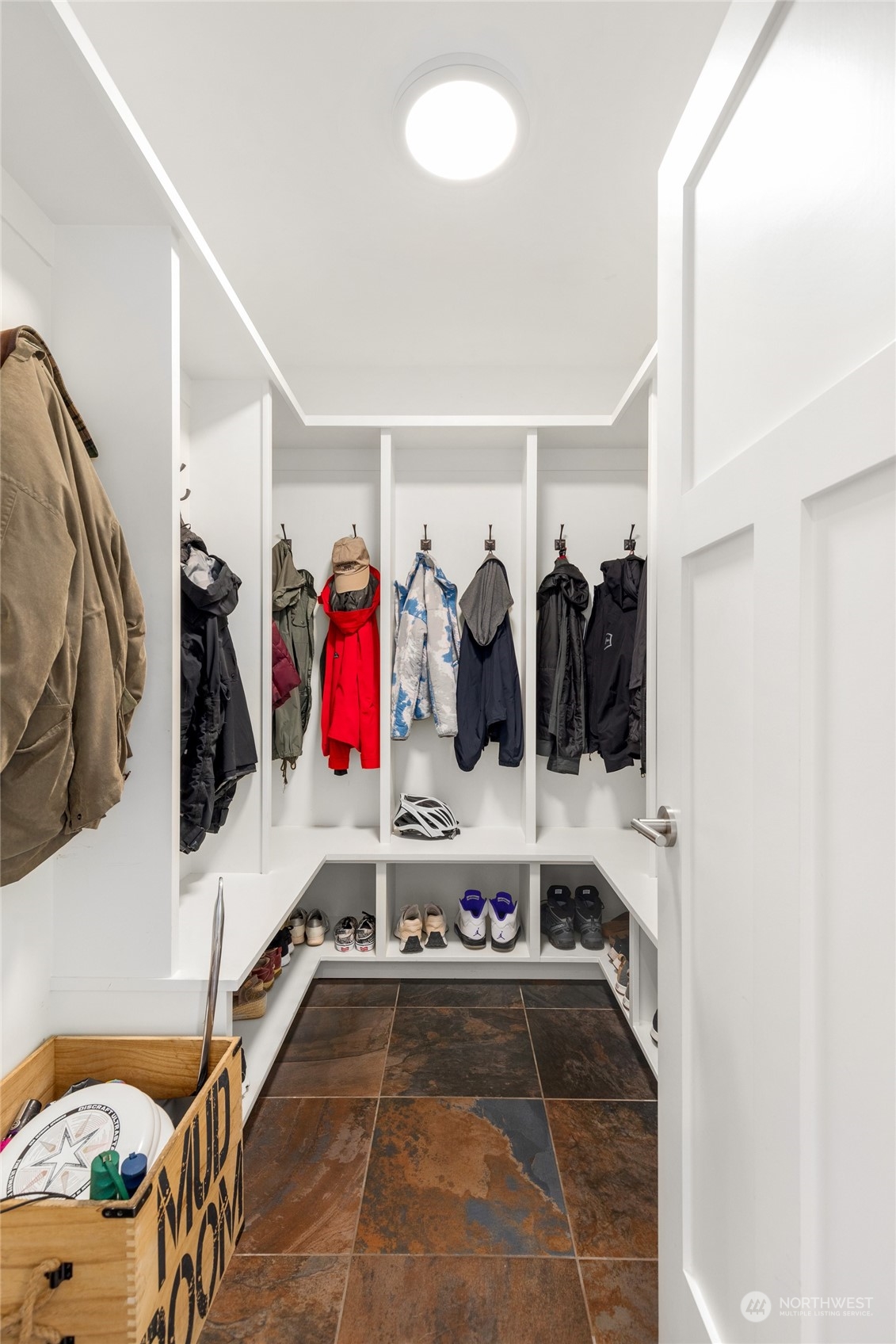 Mud room to the right of the front entry door.