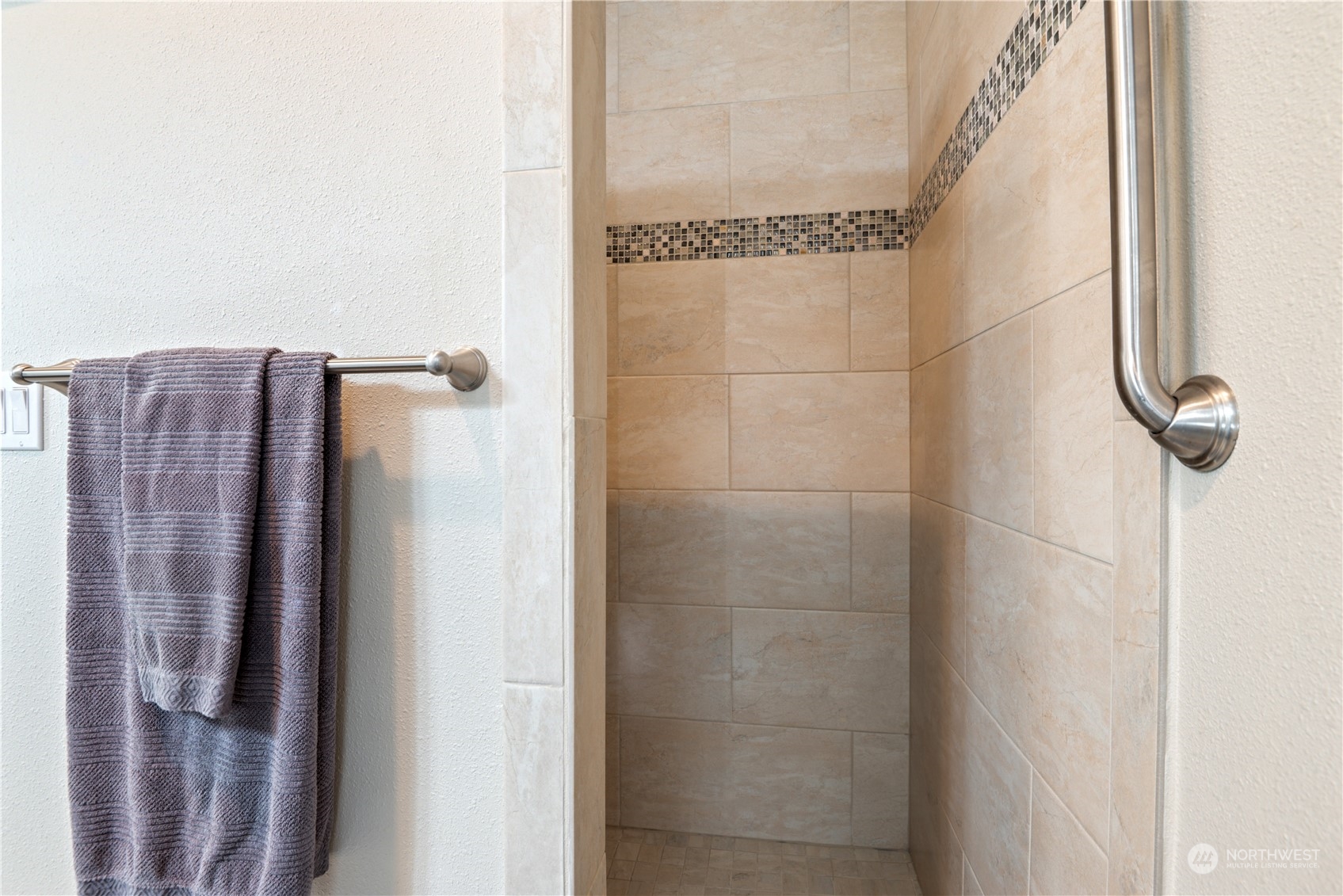 Tile walk in shower and large walk in closet