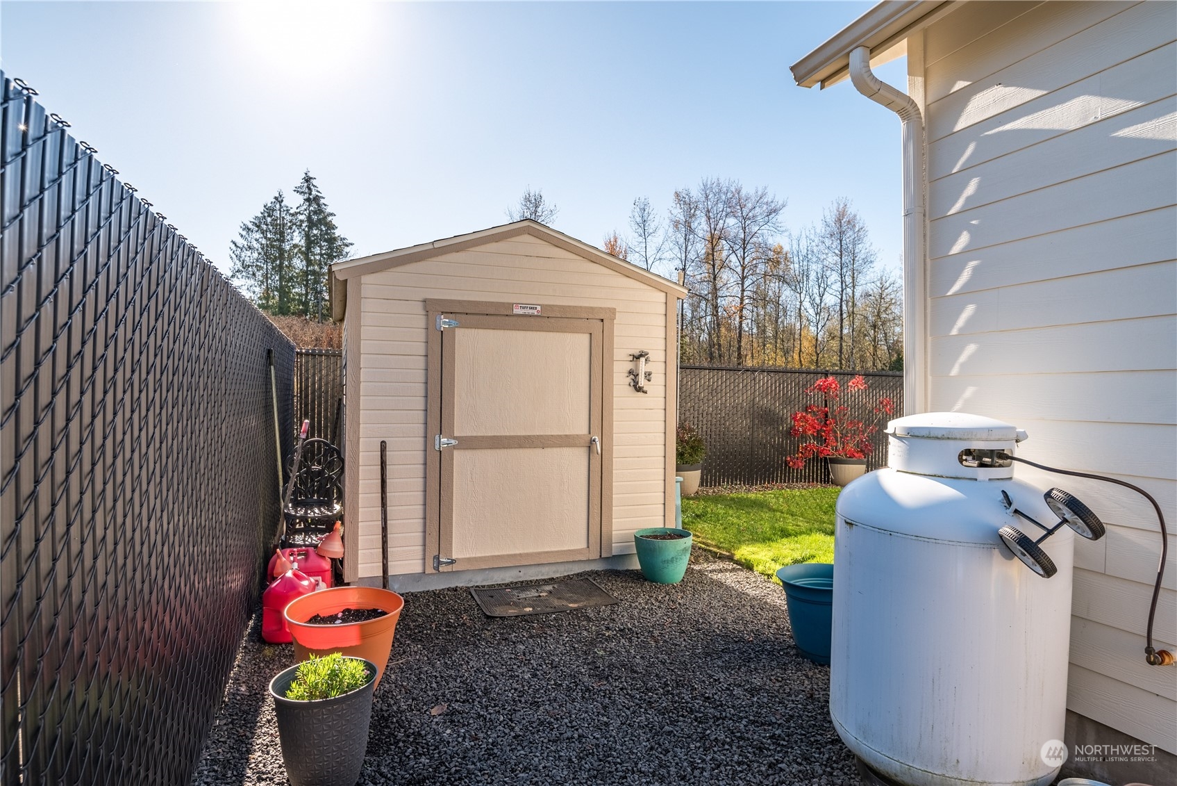 Tool shed and owned propane tank