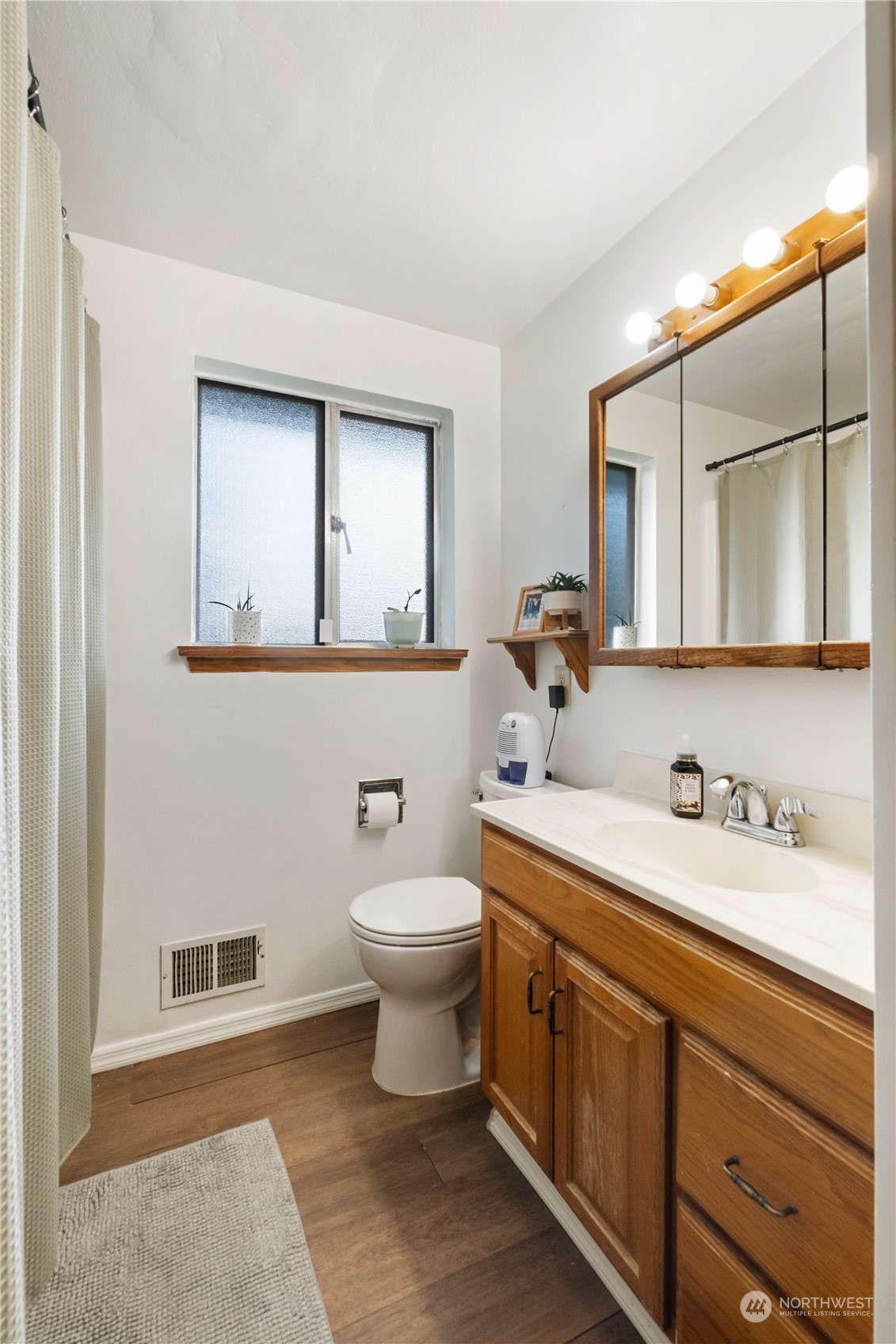 Full bathroom is clean and functional.