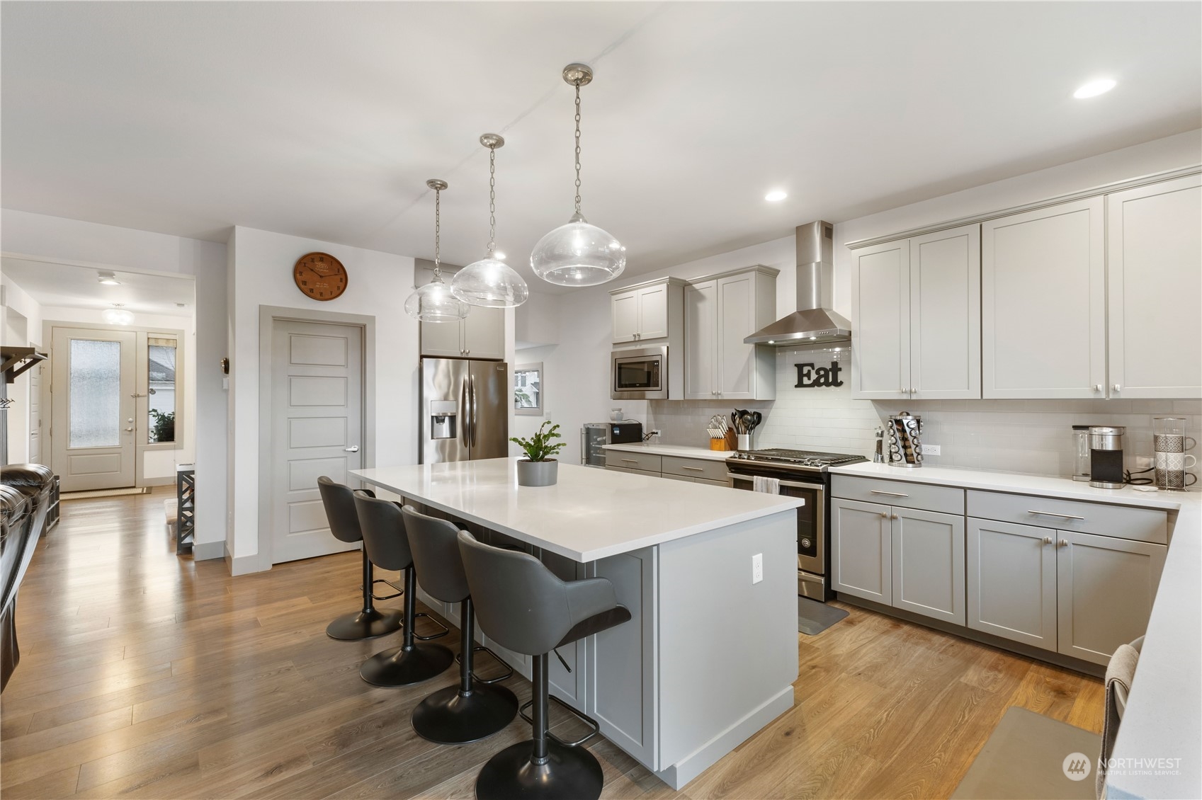 The great room opens to the kitchen with large eating bar and walk in pantry.