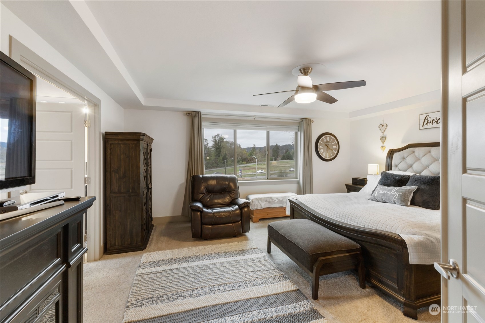 French doors open to the spacious primary bedroom.