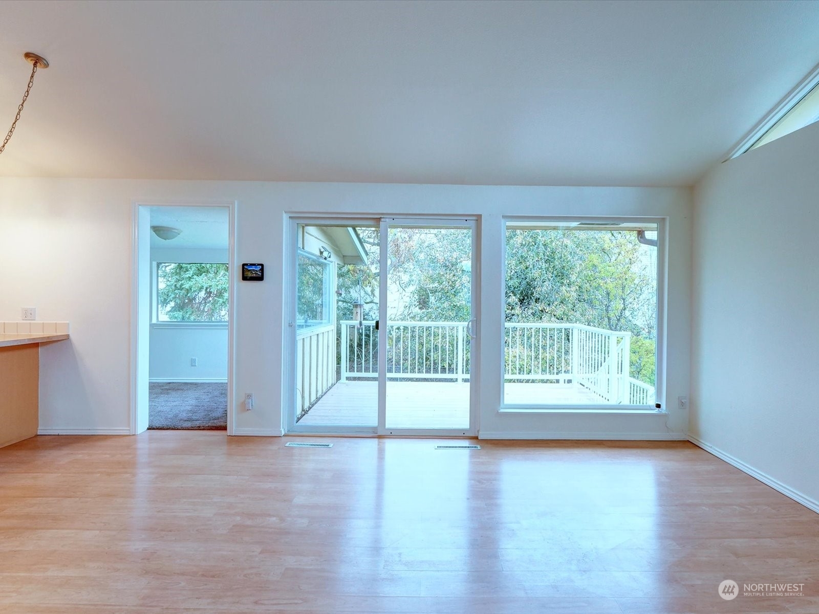 View from living room. Sun room access on left.