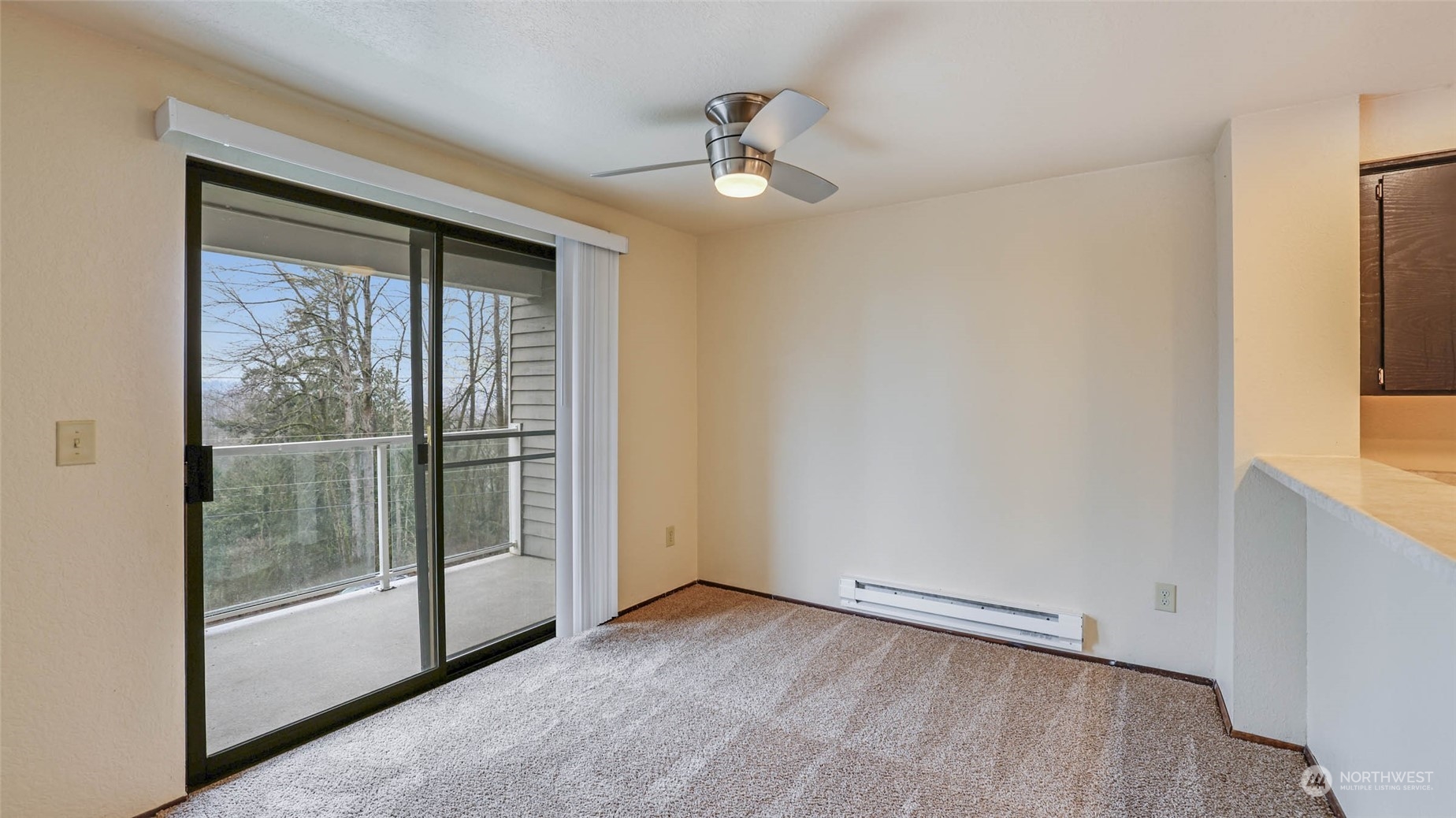 Spacious dining room with a slider that leads to your balcony and provides an abundance of light.