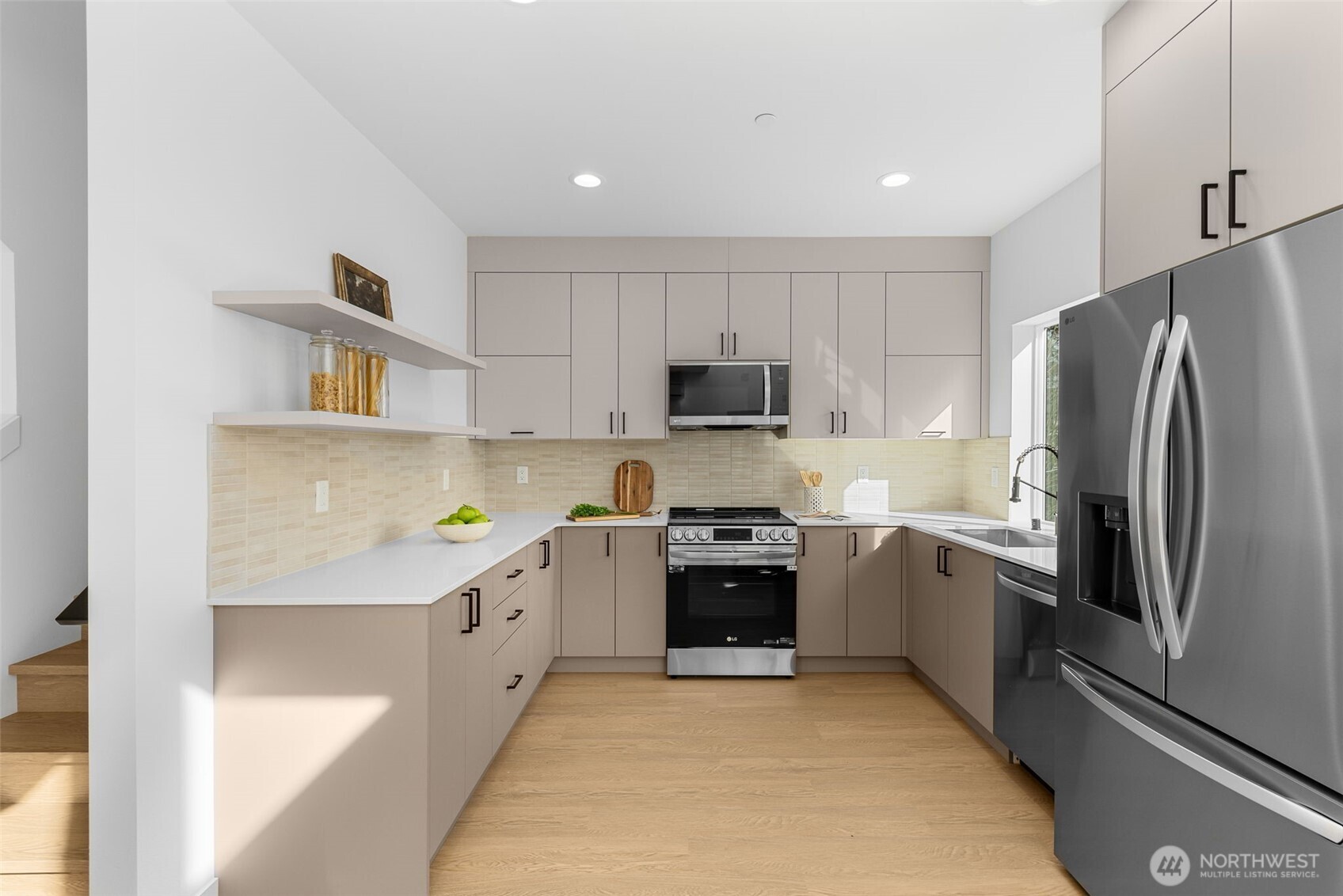 Calling all chefs! This polished kitchen is decked out with significant counter space to keep things looking fresh and functional.