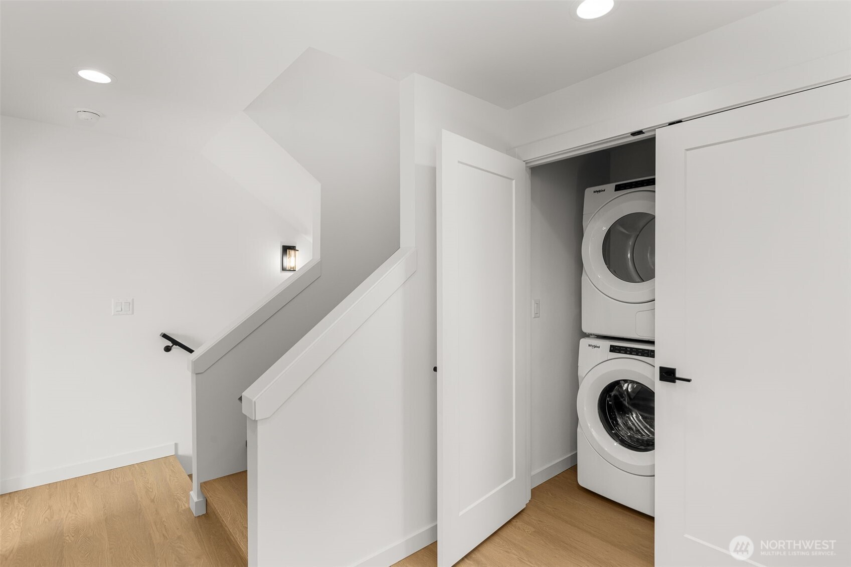 Tucked away laundry with a full-size washer/dryer—designed for convenience.