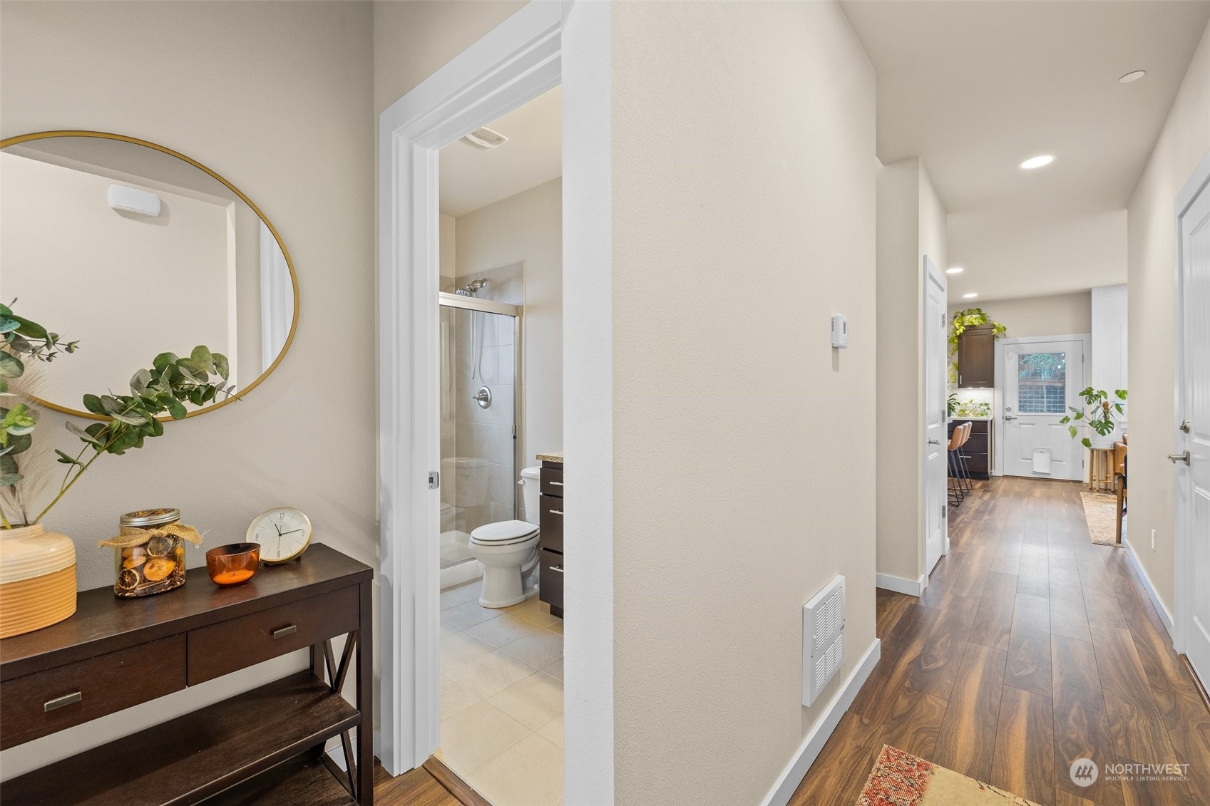 Inviting entry with high ceilings, can lighting, and hardwood floors that flow into a comfortable and stylish living space.