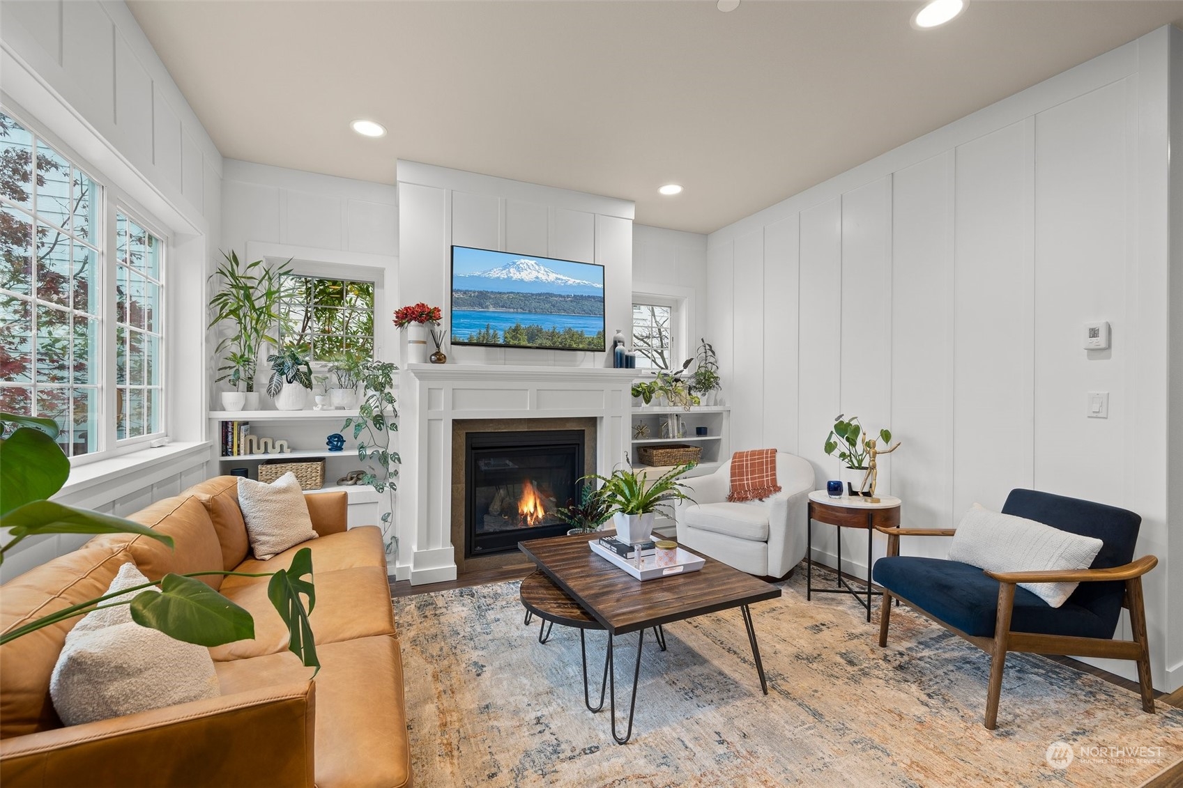 Every inch of this sweet home is utilized well. Enjoy the built-in bookcases and smurf tube wiring above the fireplace to hide electronic cords.