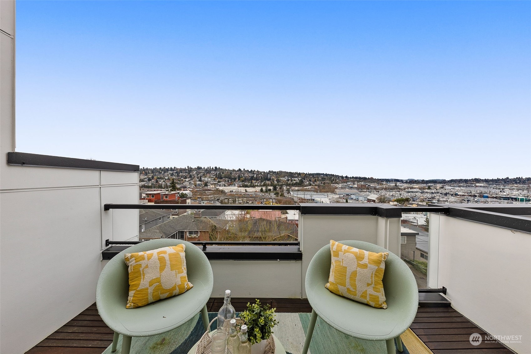 This cozy balcony invites you to enjoy your morning coffee or an evening glass of wine while soaking in picturesque views of the serene neighborhood and beyond.