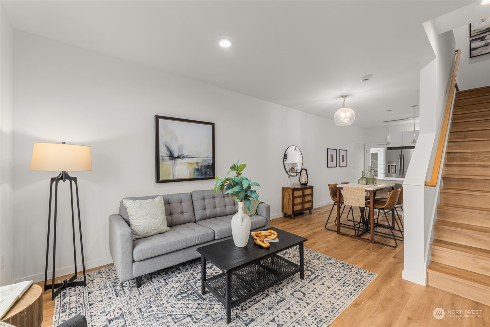 Comfort and style unite in this open-concept living area. Perfect for entertaining, the cozy seating space flows seamlessly into the dining area.