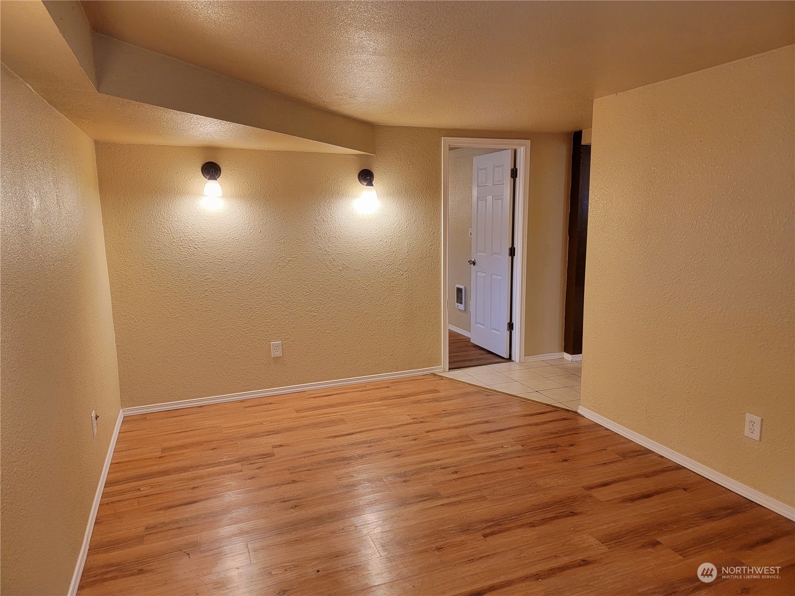 Lower unit/ADU living room. Door to left is to 1st bedroom