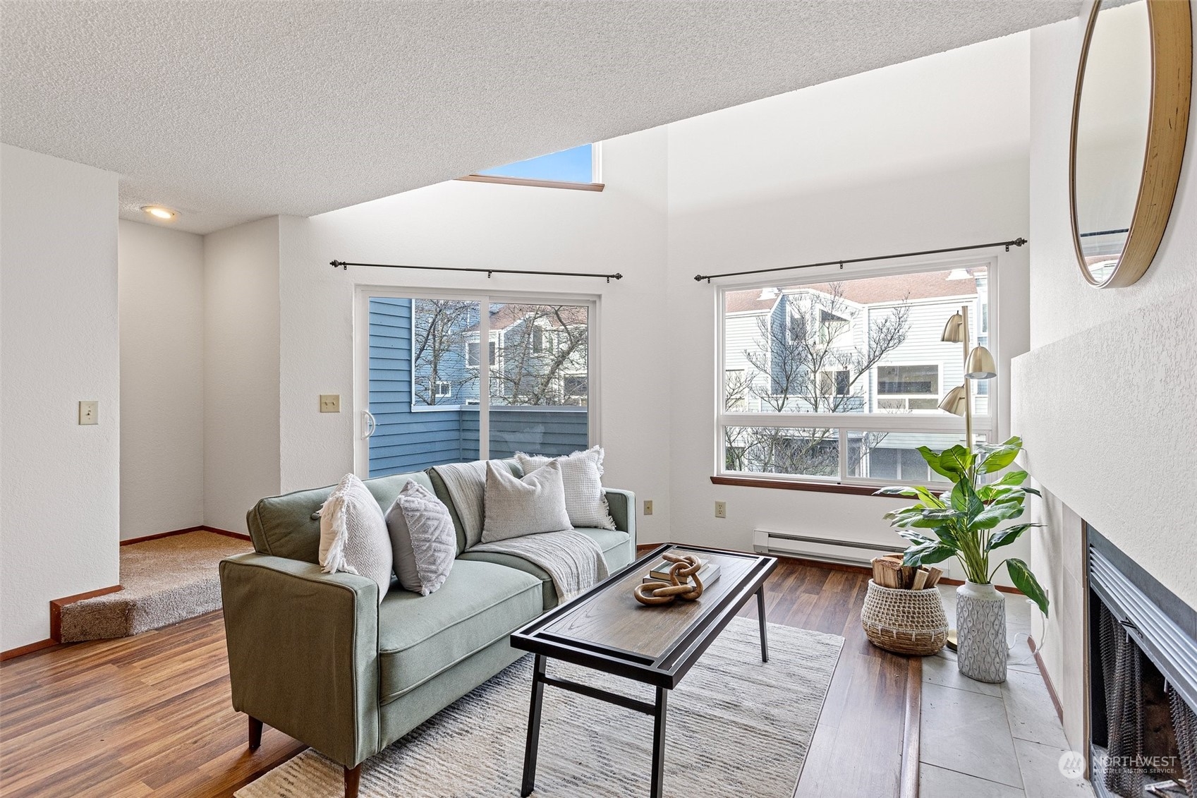 Bright natural light pours into the living room