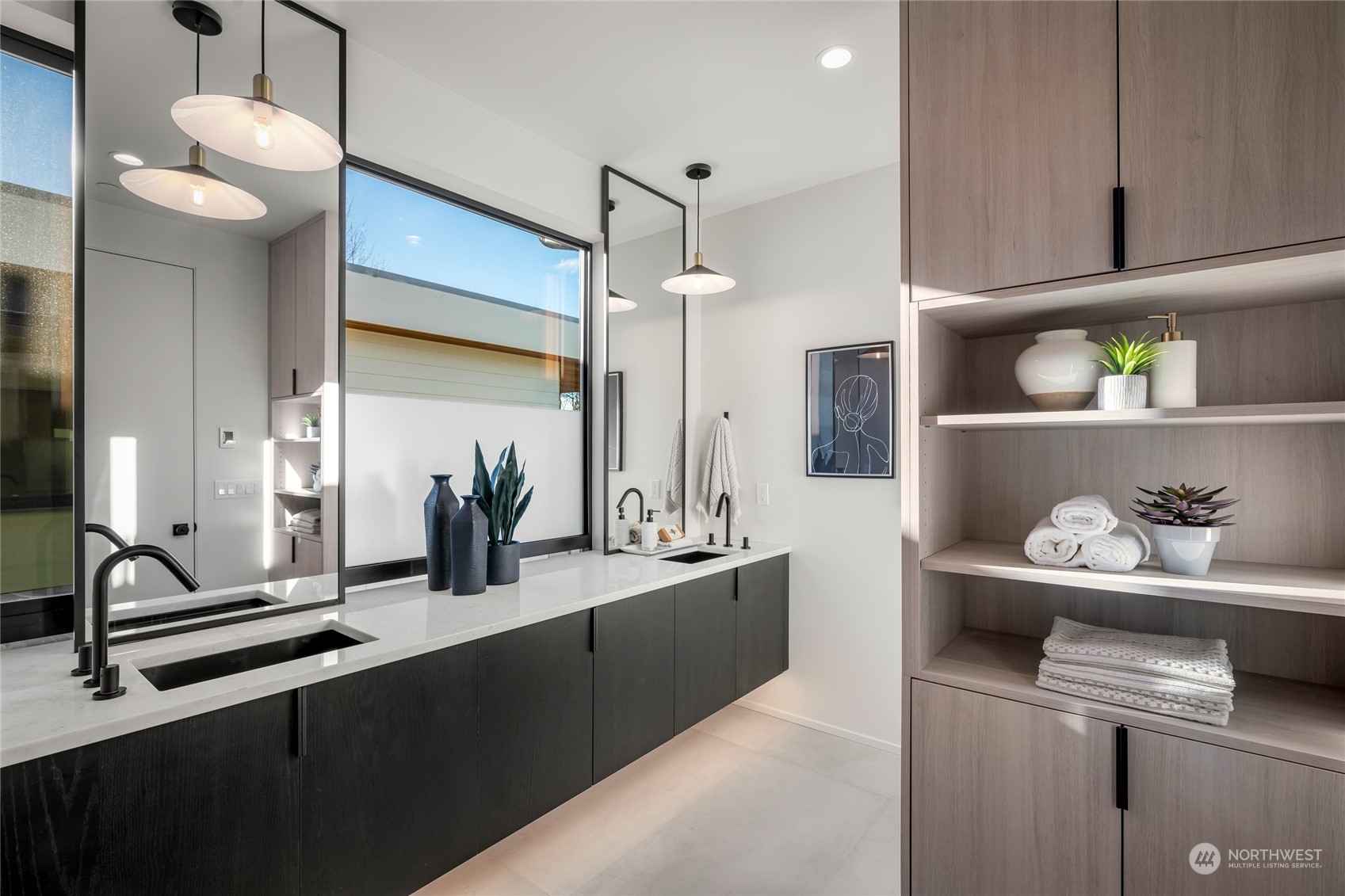 Primary Bath: Indulge in luxury with heated floors, custom cabinets, and a sleek double vanity with modern ramp sinks.