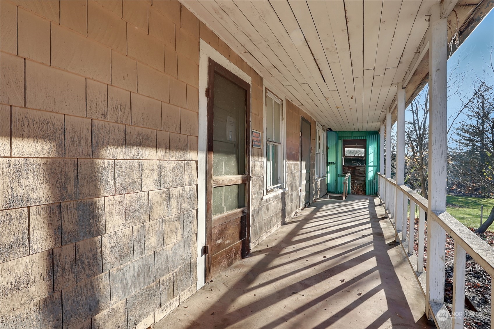 Covered Front Porch overlooks the large acre parcel