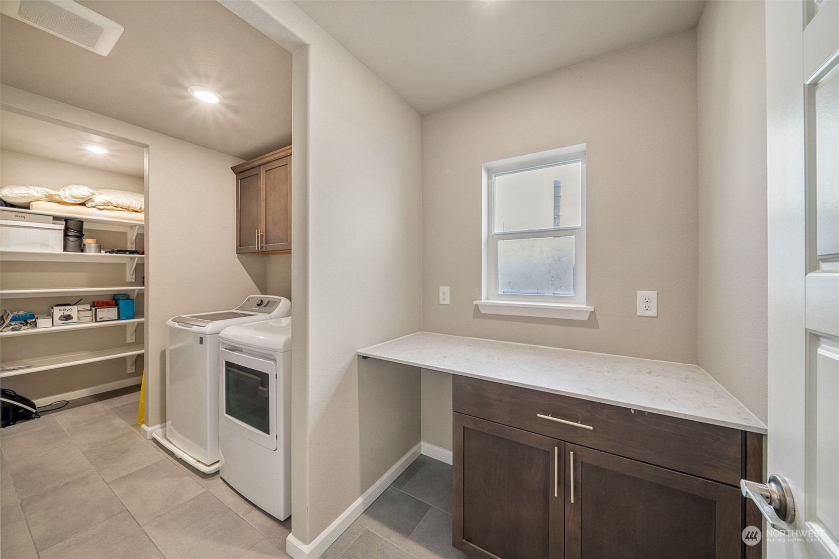 Large Laundry with Counter Space and Closet for Storage