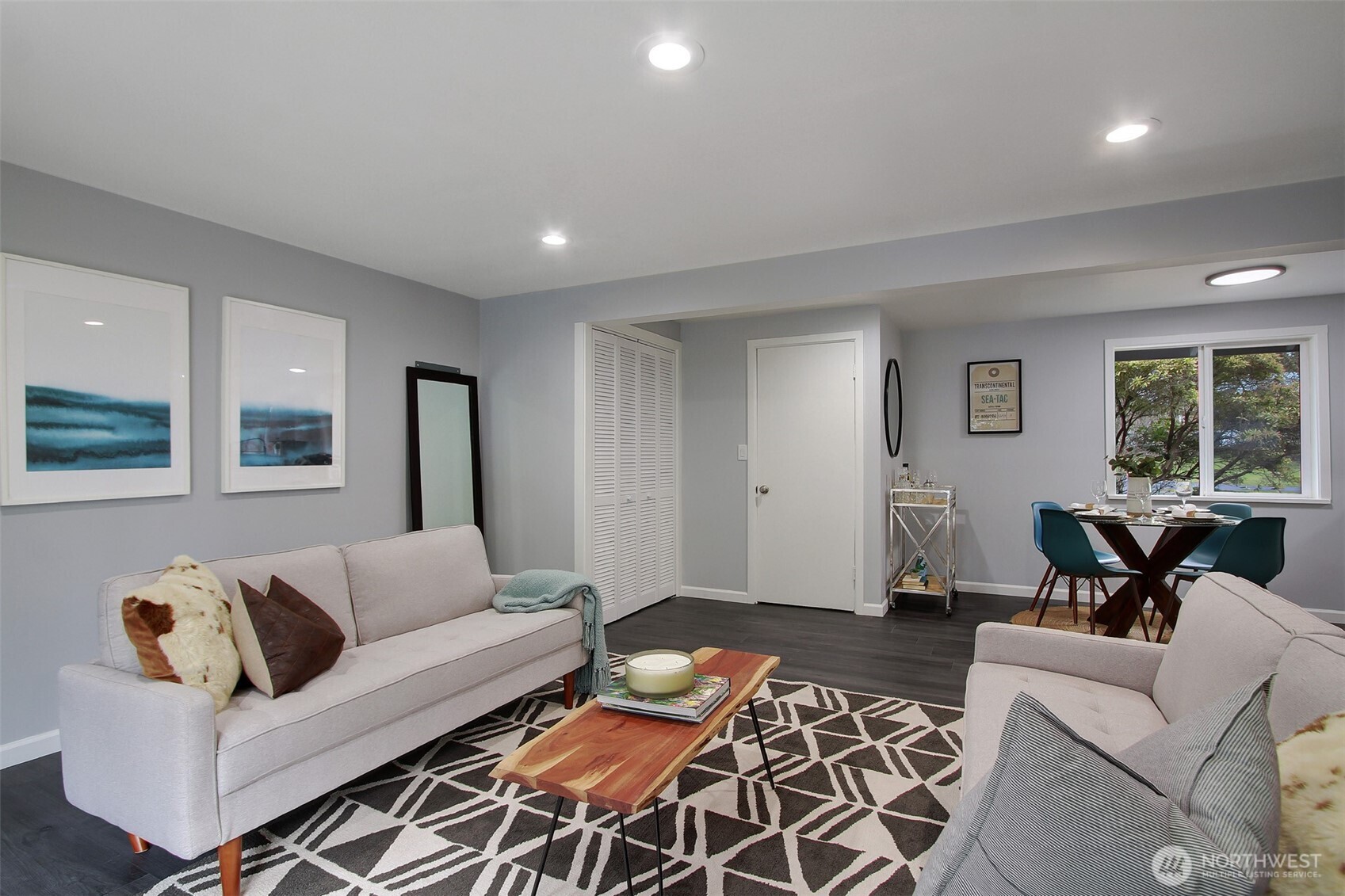 Second living area with dining in the background.