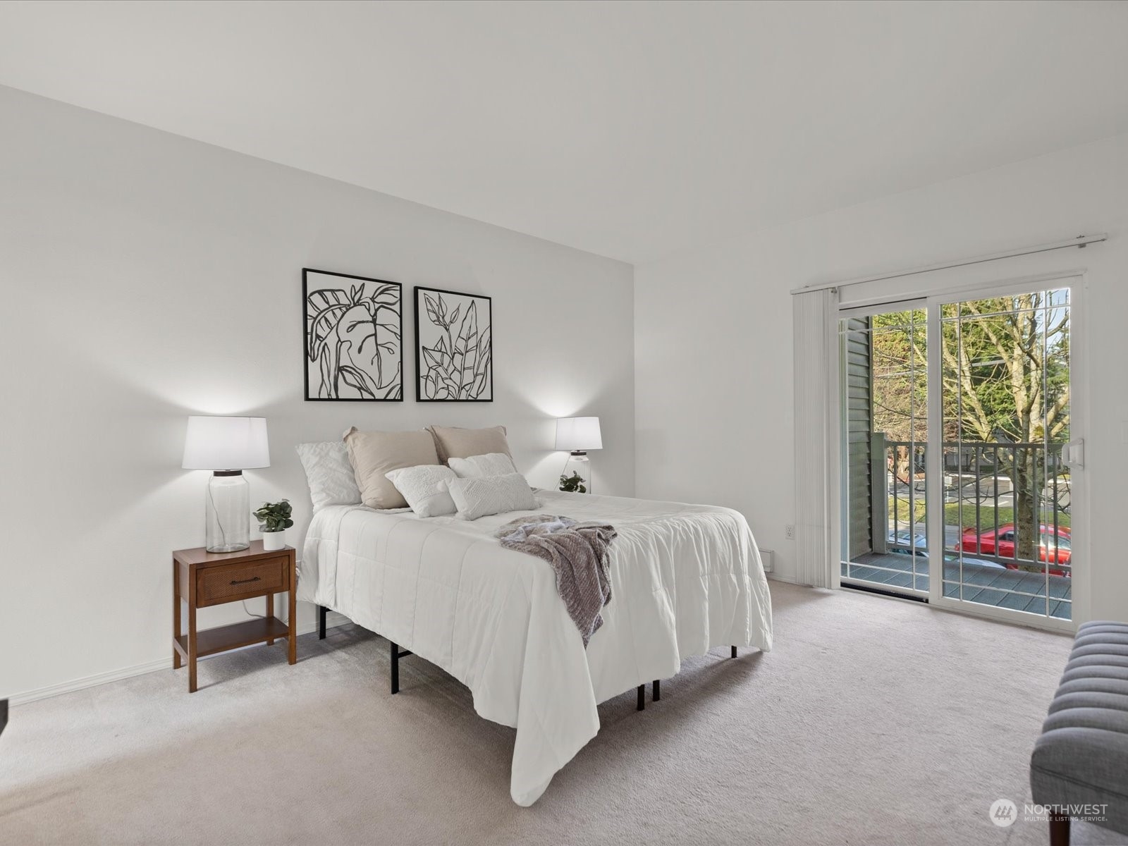 The main bedroom offers direct balcony access, a sizable walk-in closet, and a luxurious ensuite bath.