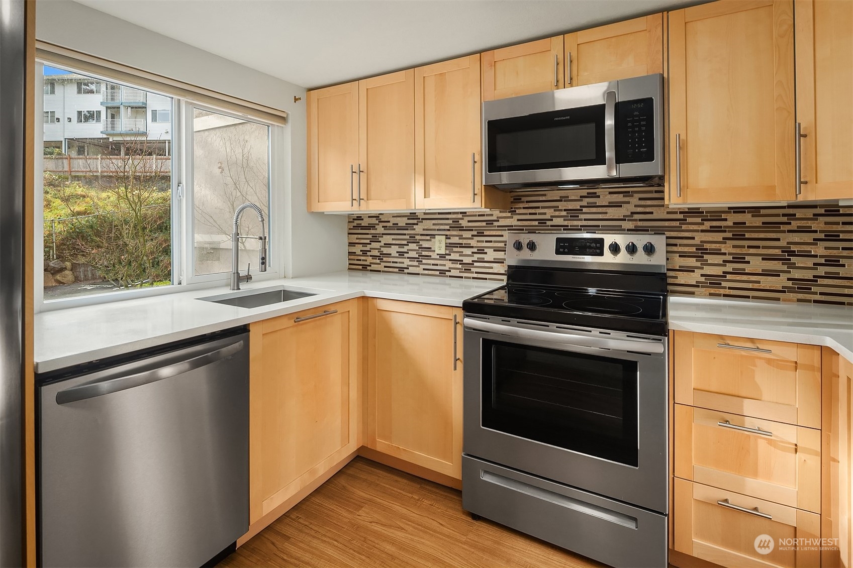 The kitchen looks out over the front of the building.