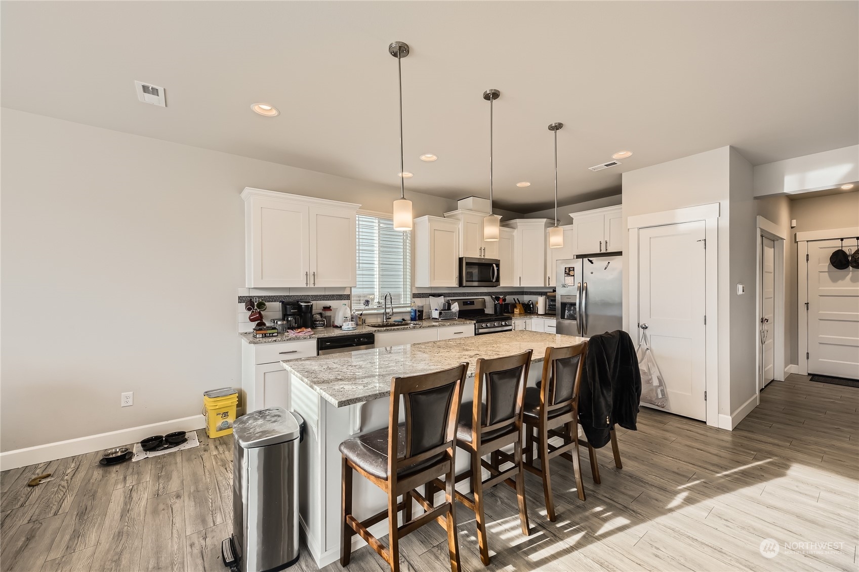 Pendant lights throughout the kitchen.