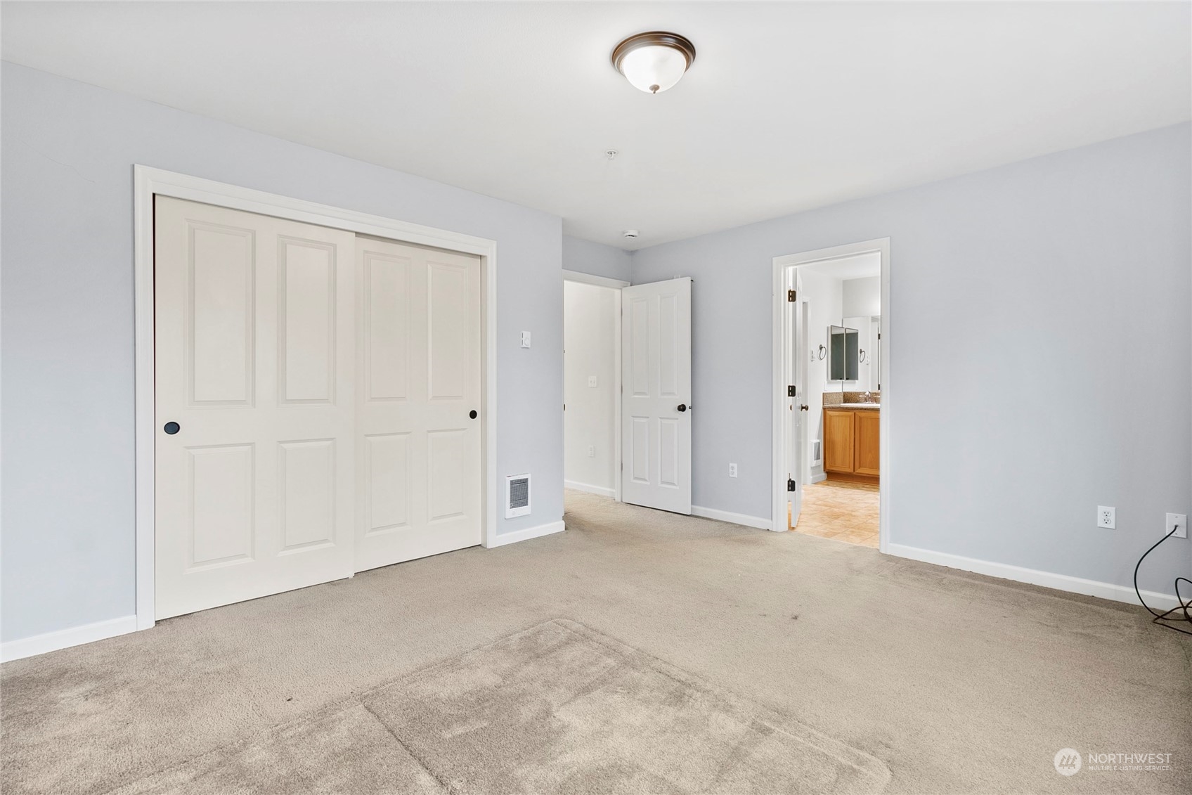 Primary bedroom with natural lighting