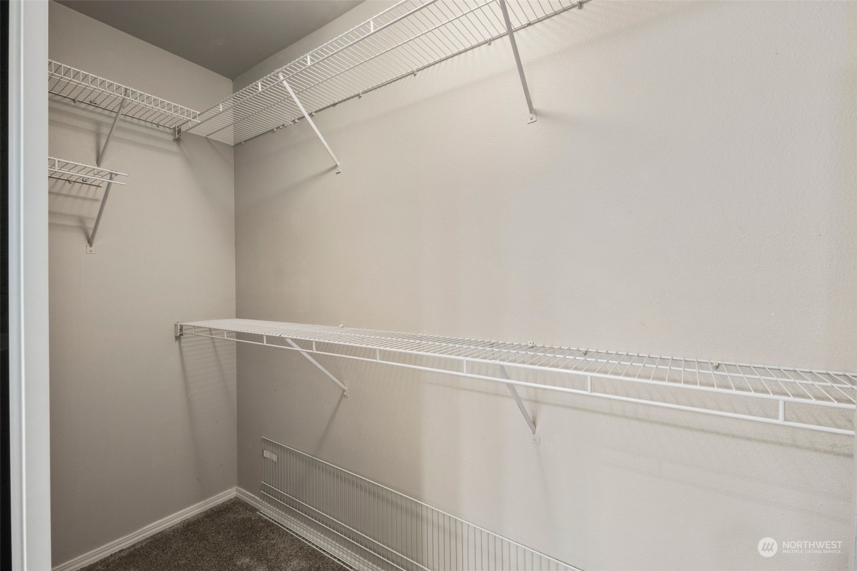 This walk in closet is large, you've got immense space in here.