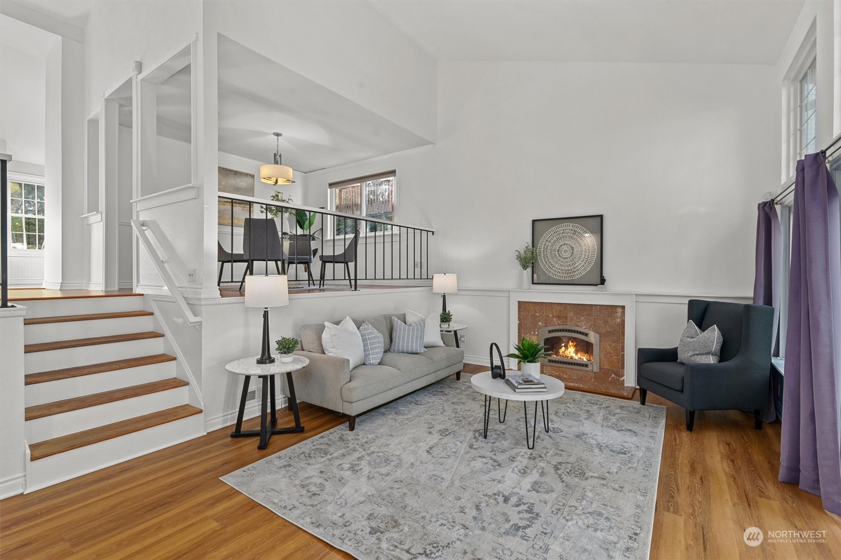 Spacious living room featuring French doors that open to the backyard