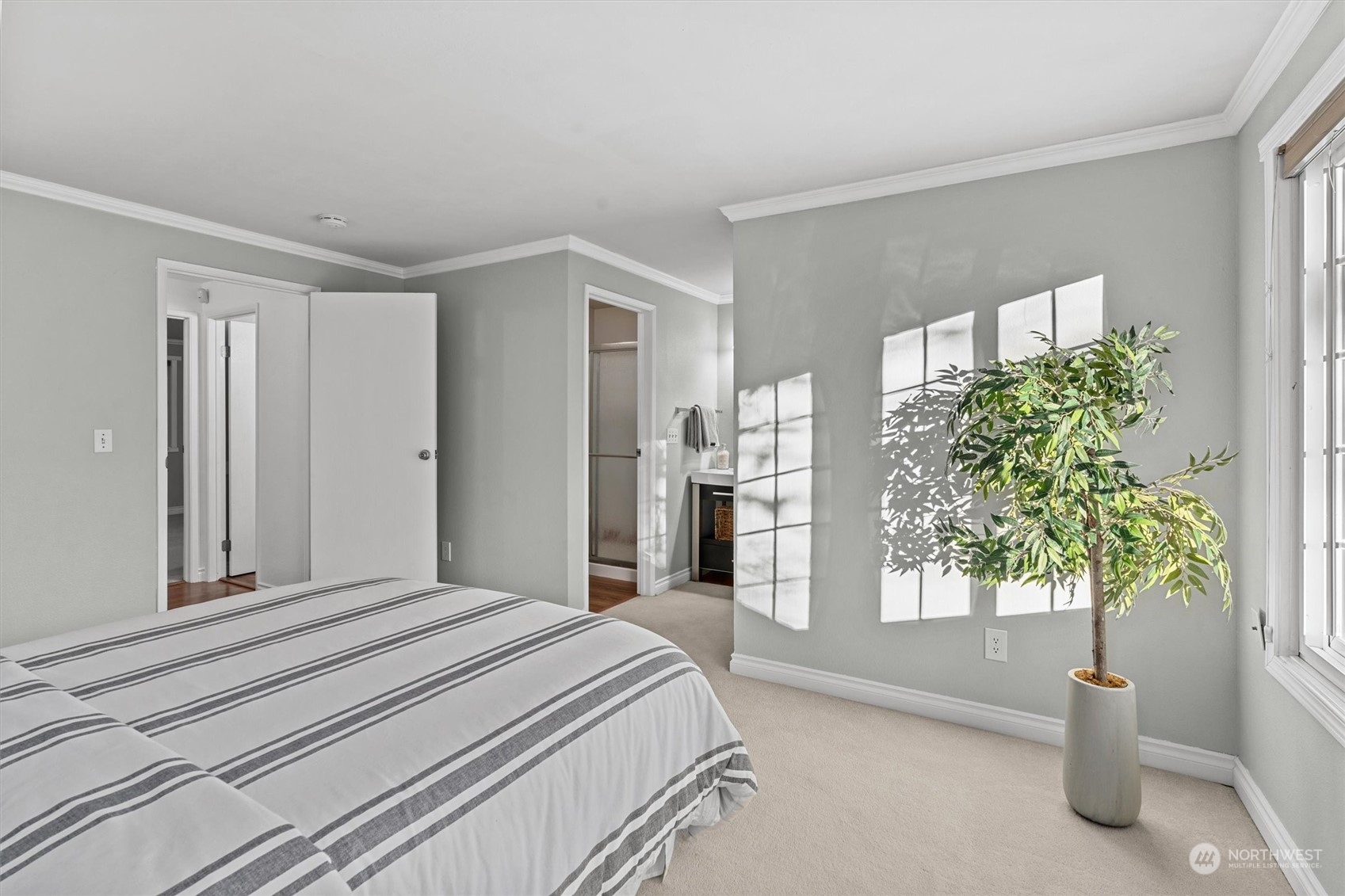 Primary bedroom with ensuite bathroom and walk-in closet