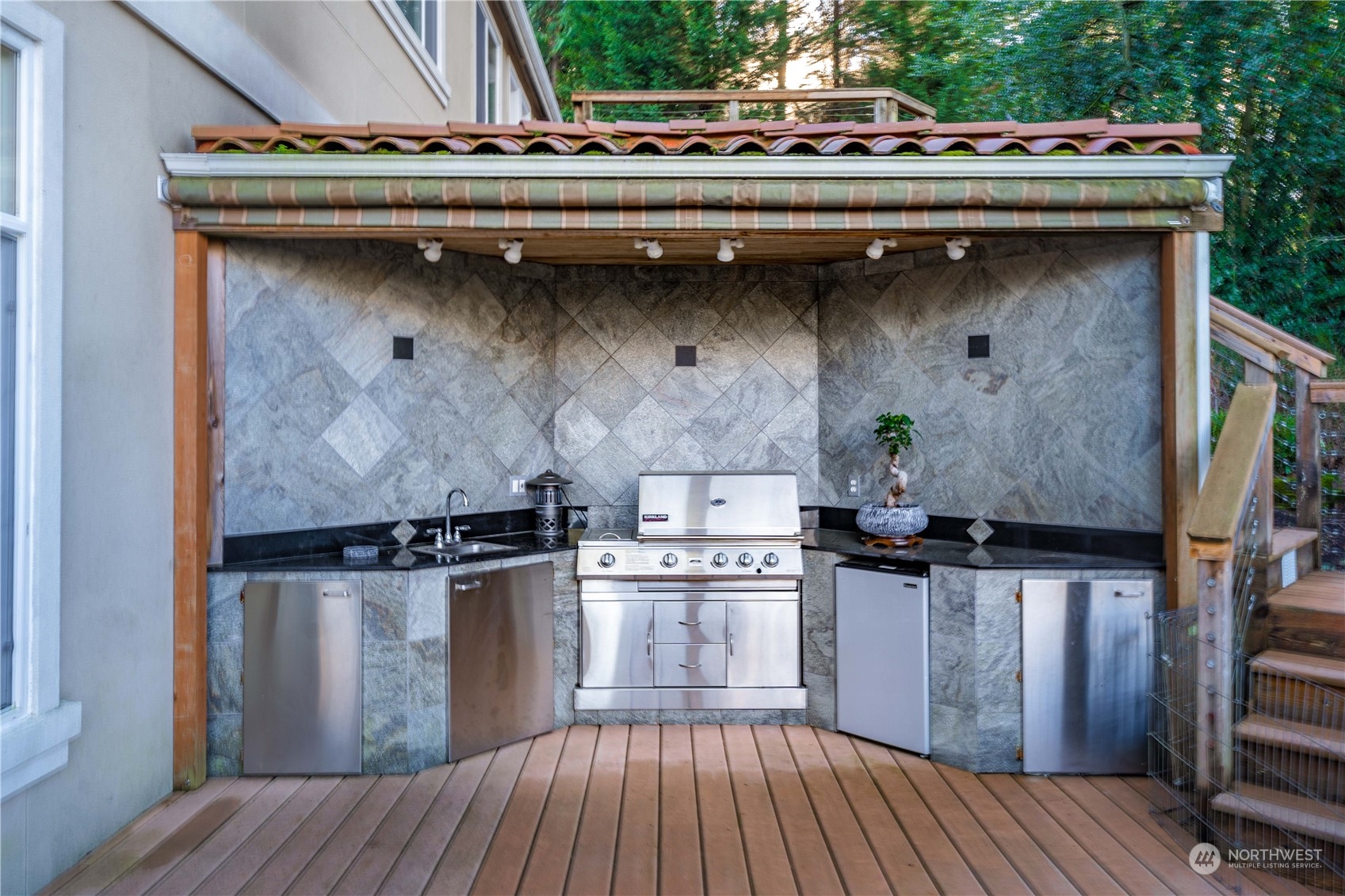 A covered built-in BBQ on the main deck