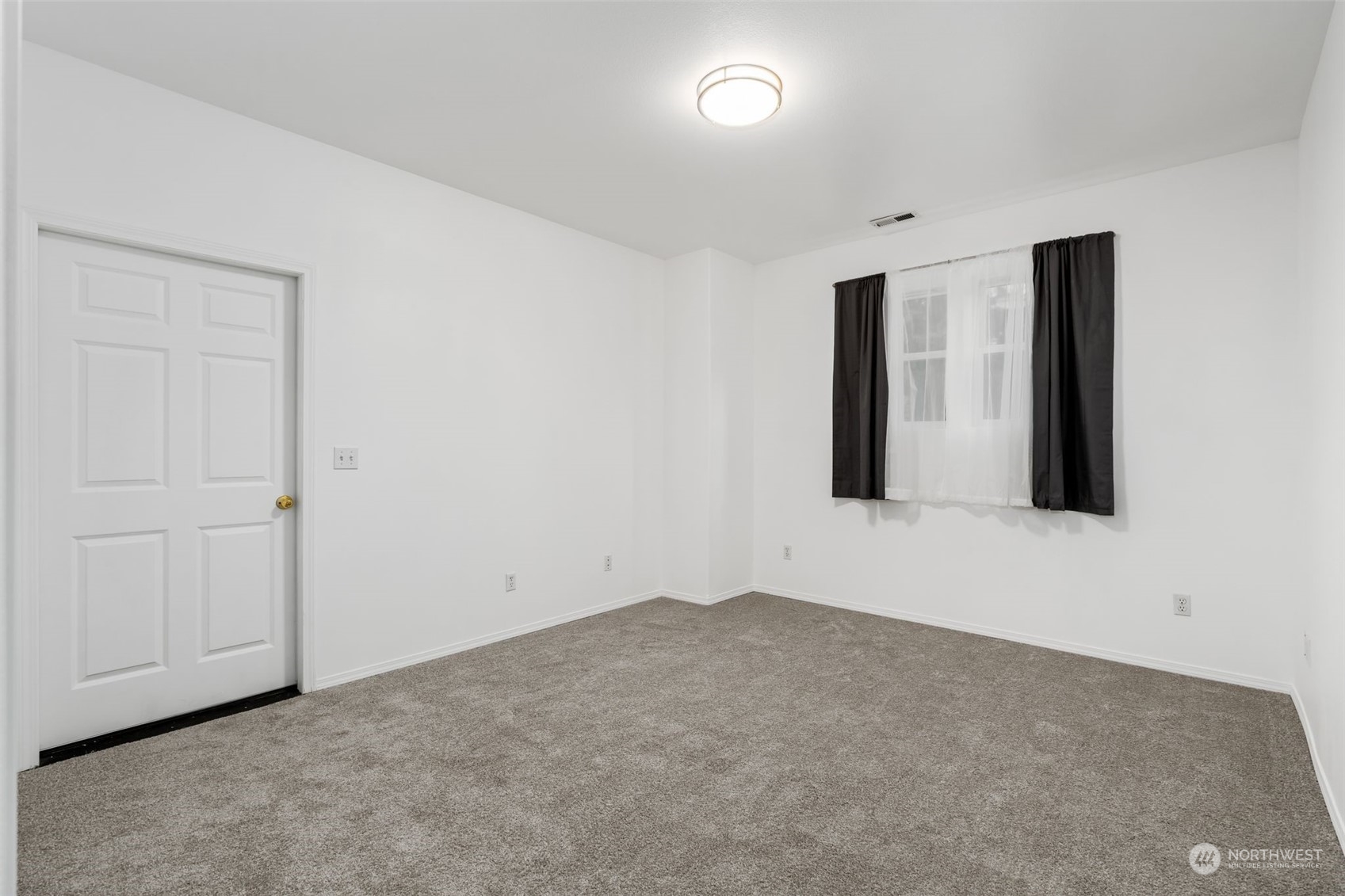 Basement Room: Versatile basement space with neutral tones, perfect for a playroom, office, or guest suite.