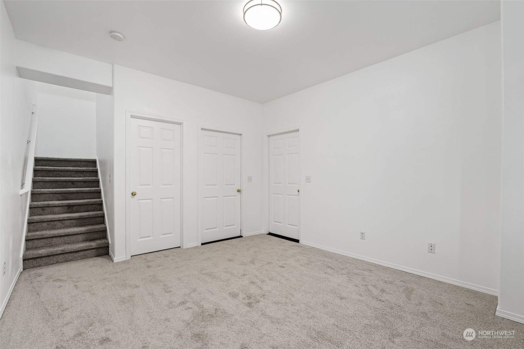 Basement Room: Versatile basement space with neutral tones, perfect for a playroom, office, or guest suite.