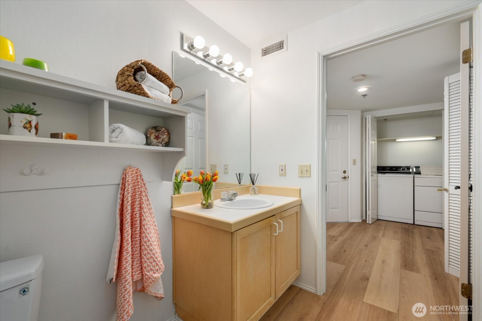 Full bathroom with shower and tub. New LVP flooring.