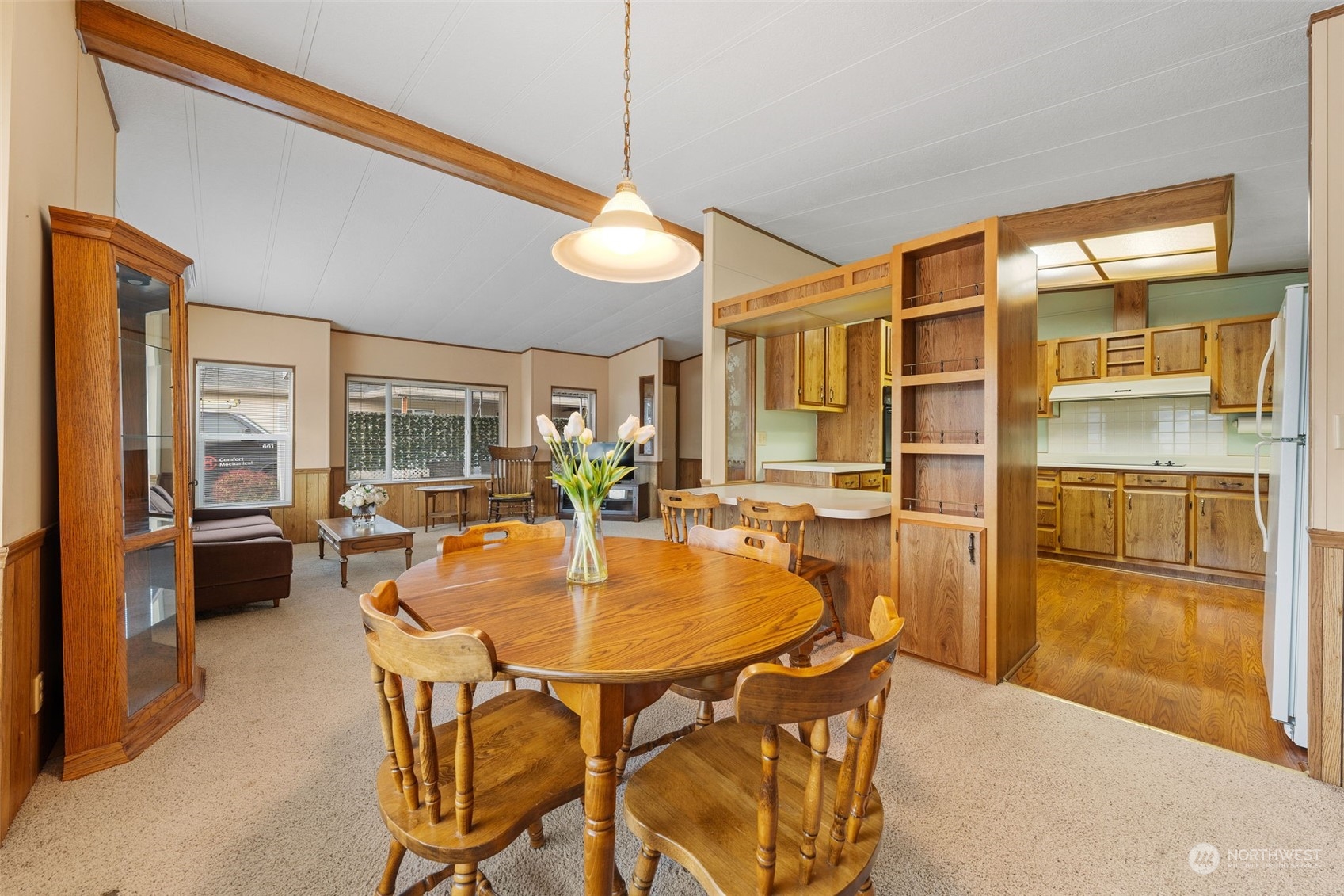 Living room and opens to dining area.