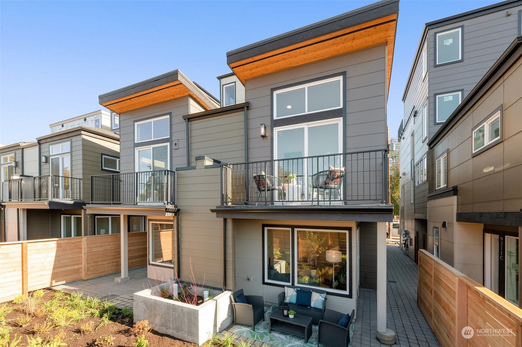 Private back patio with planter boxes and space to lounge—peaceful and low-maintenance.