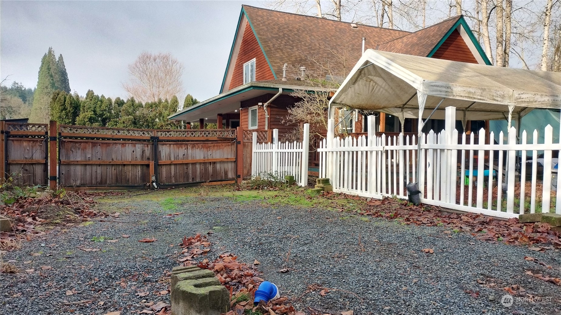 More pics to come.  This is the far side of the house showing the gate to the backyard which is fenced and ready for pets!