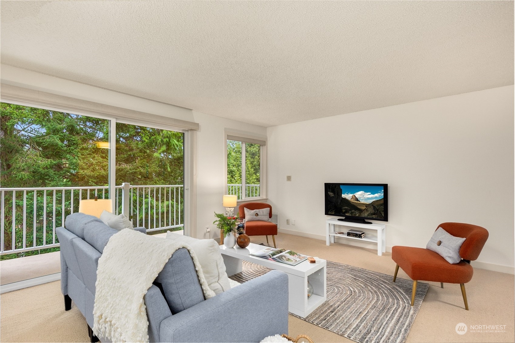 Spacious living room with new carpet and paint